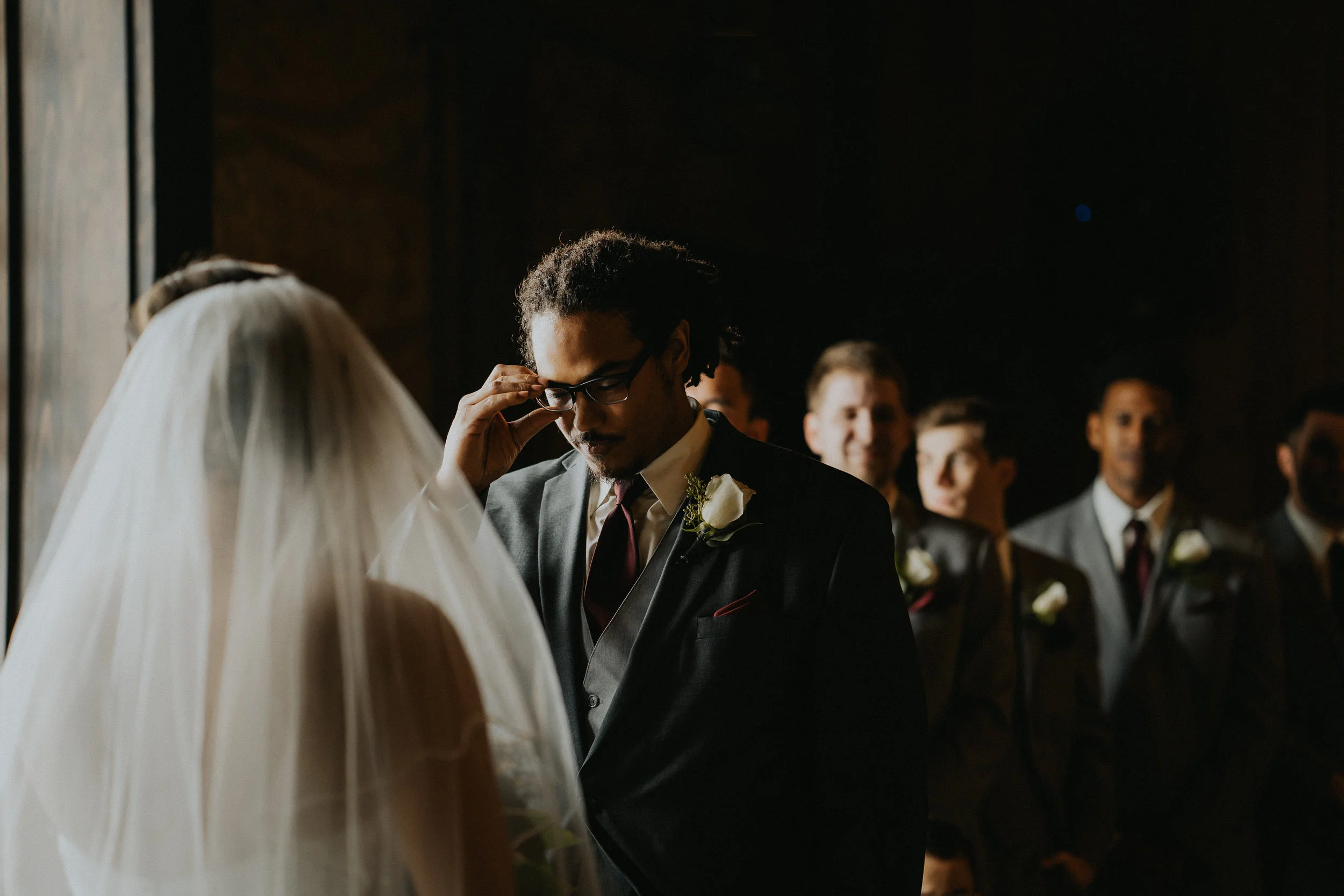 Groom glasses adjust Photographer