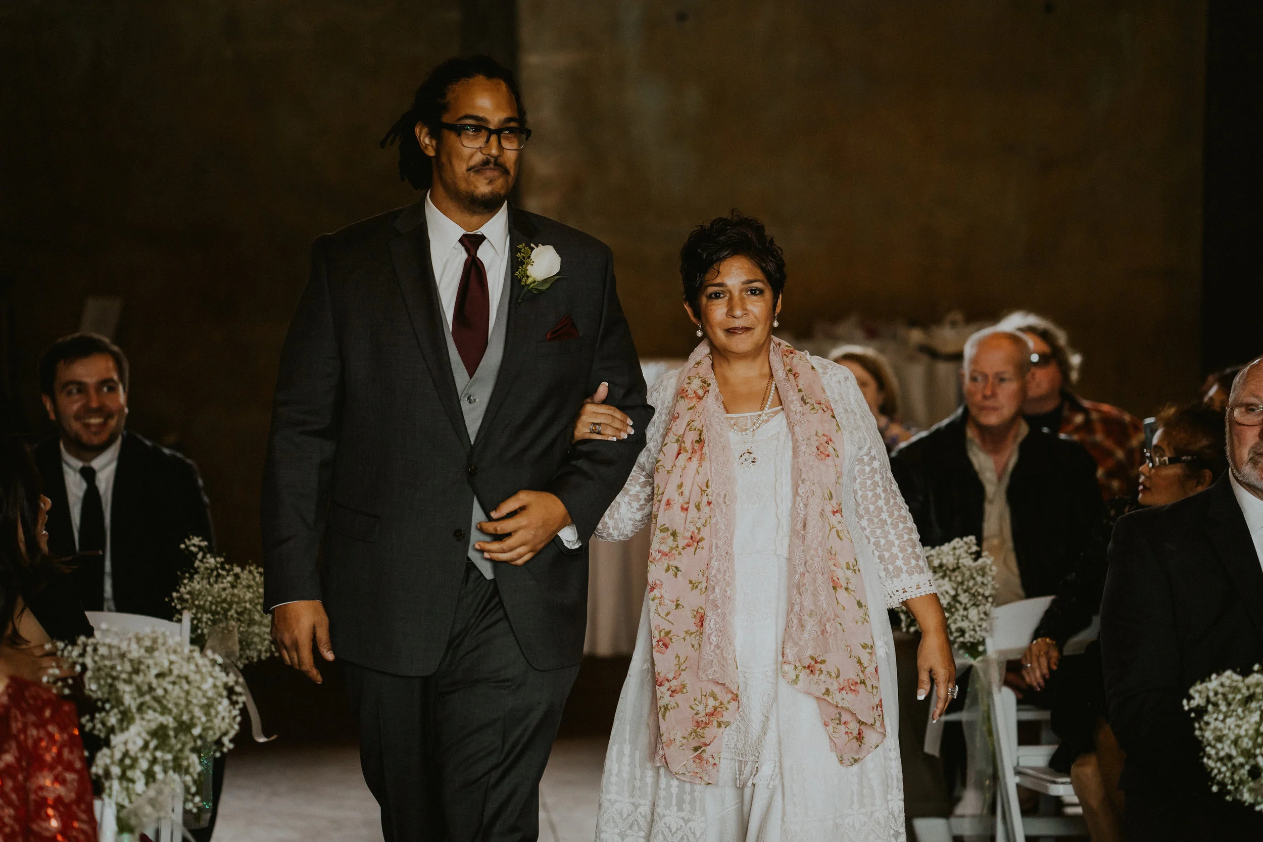 Groom mother walk aisle wedding