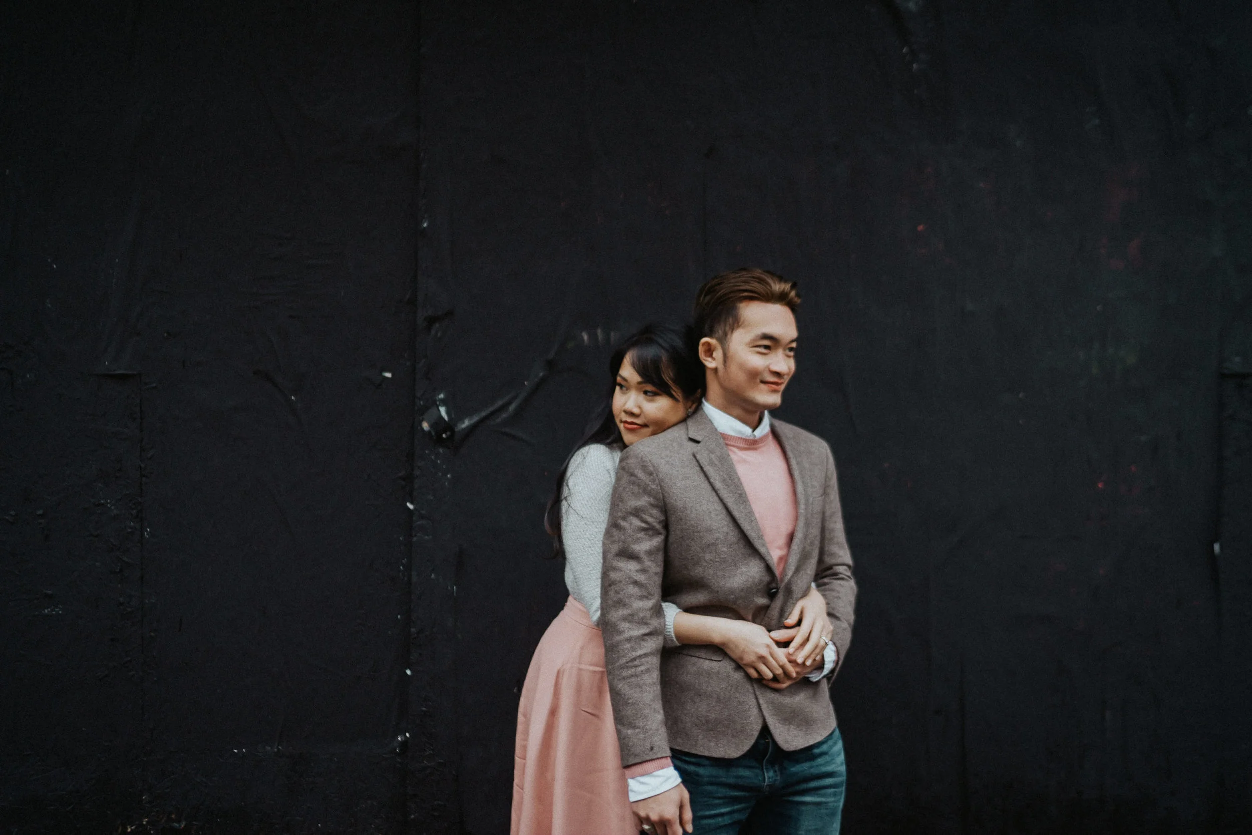 fashion engagement photography black wall