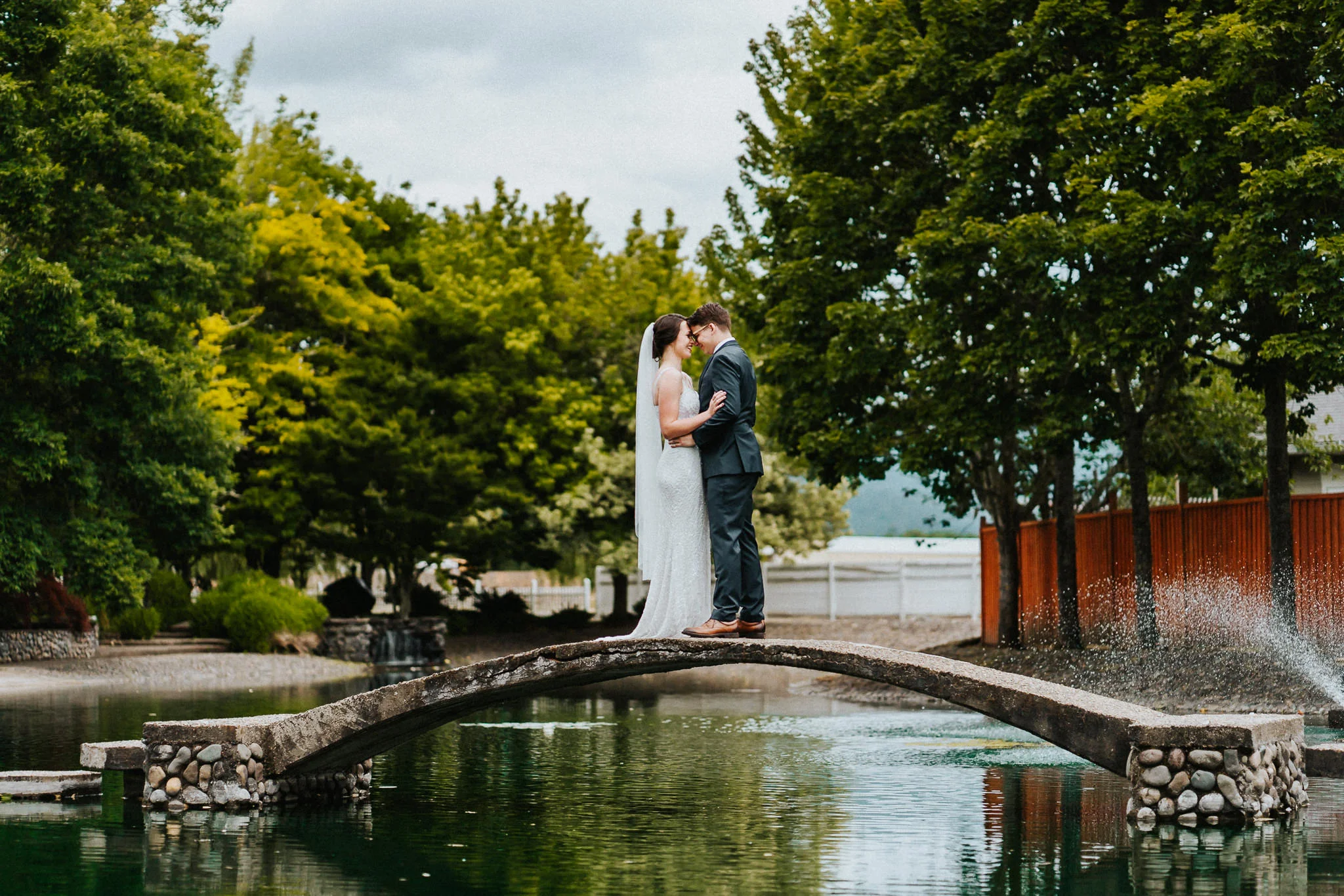 Water Oasis Bridge Fountain Bride Groom Portrait