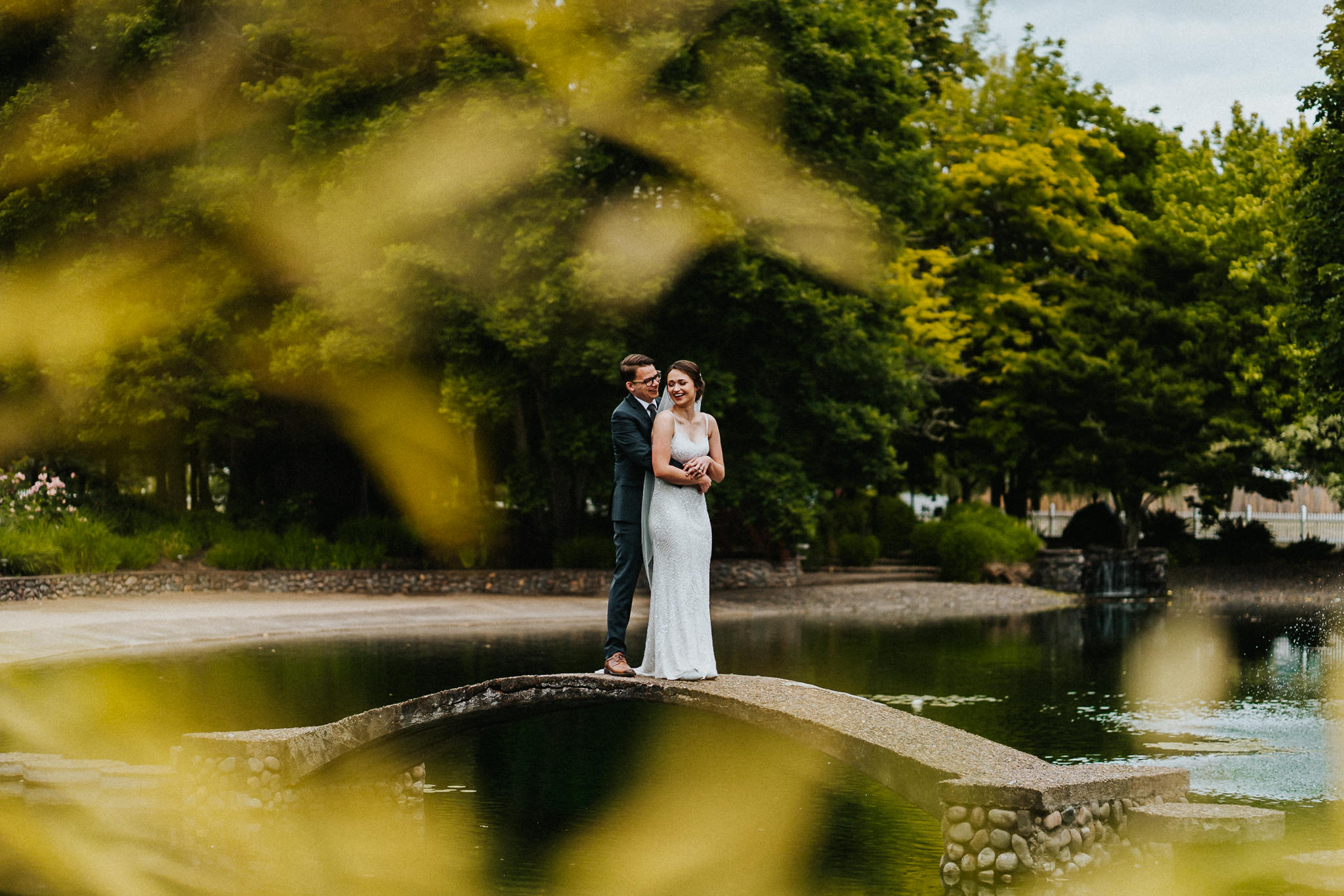 Dark Moody Wedding Portrait Bride Groom Bridge Water Bamboo Leaves