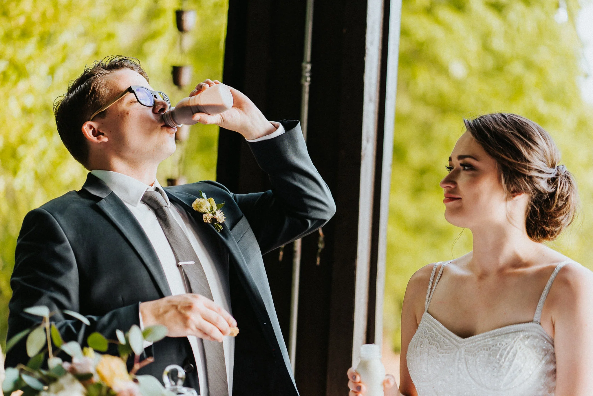 Groom drink milk cut cake wedding reception