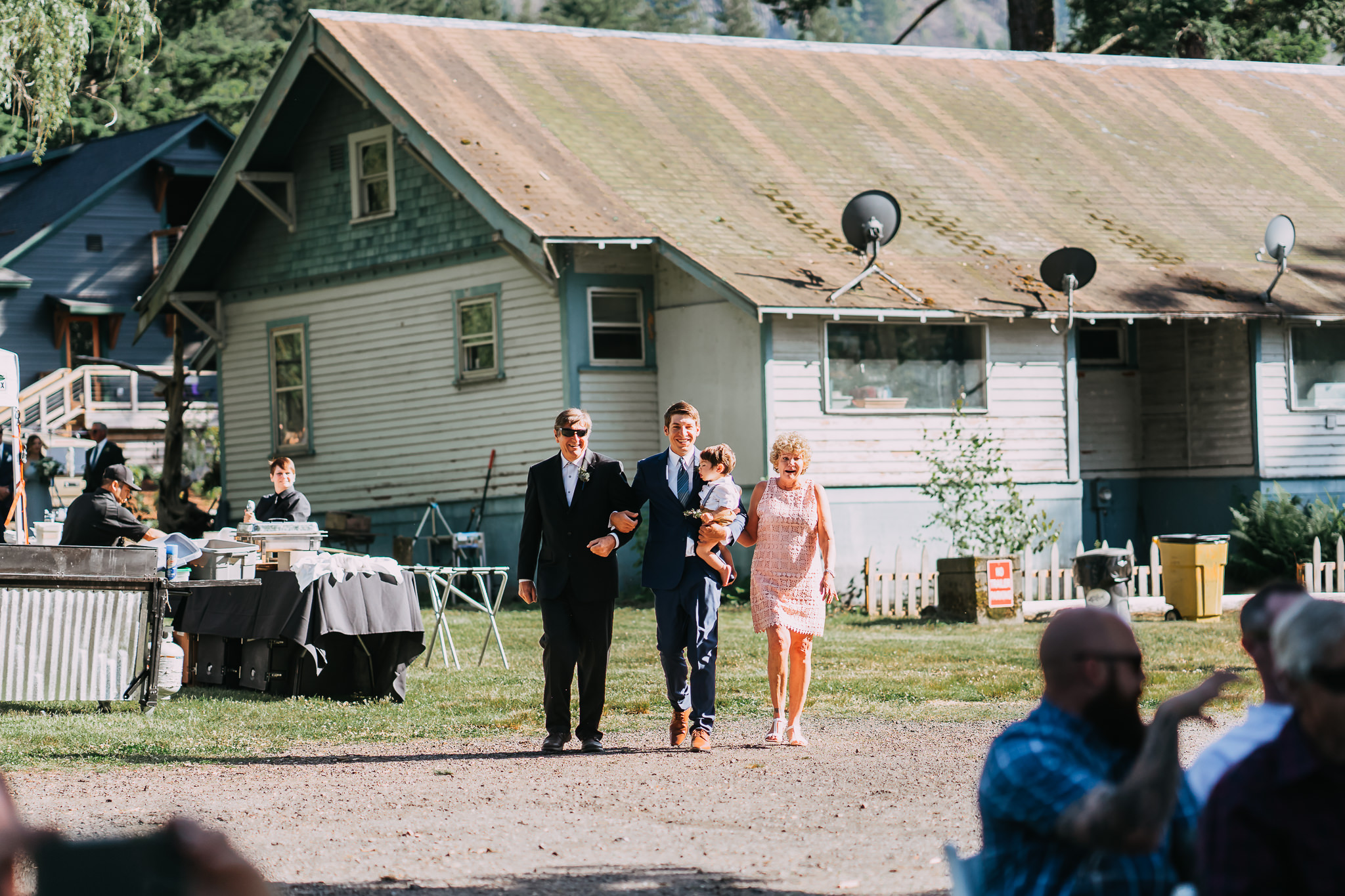 Groom Parents walk down aisle