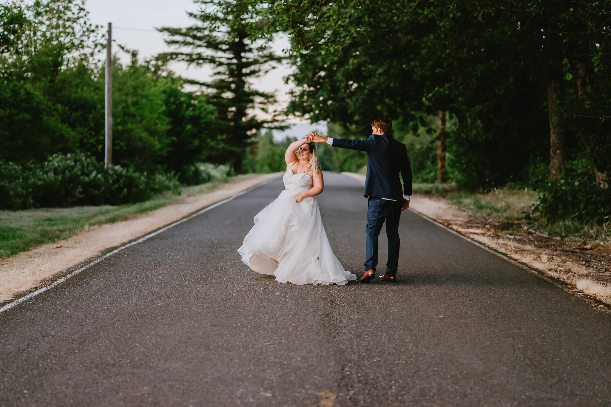 Groom twirl bride dress flow sunset Portland Oregon Wedding Photographer Alfred Tang