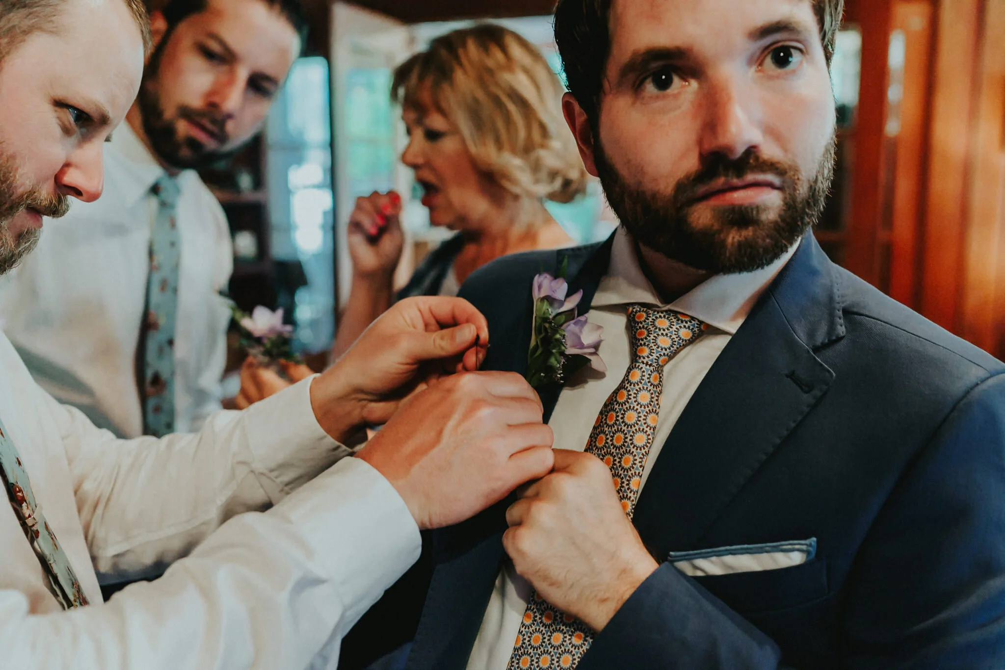 Groom groomsmen boutonniere grooms bread blue suit