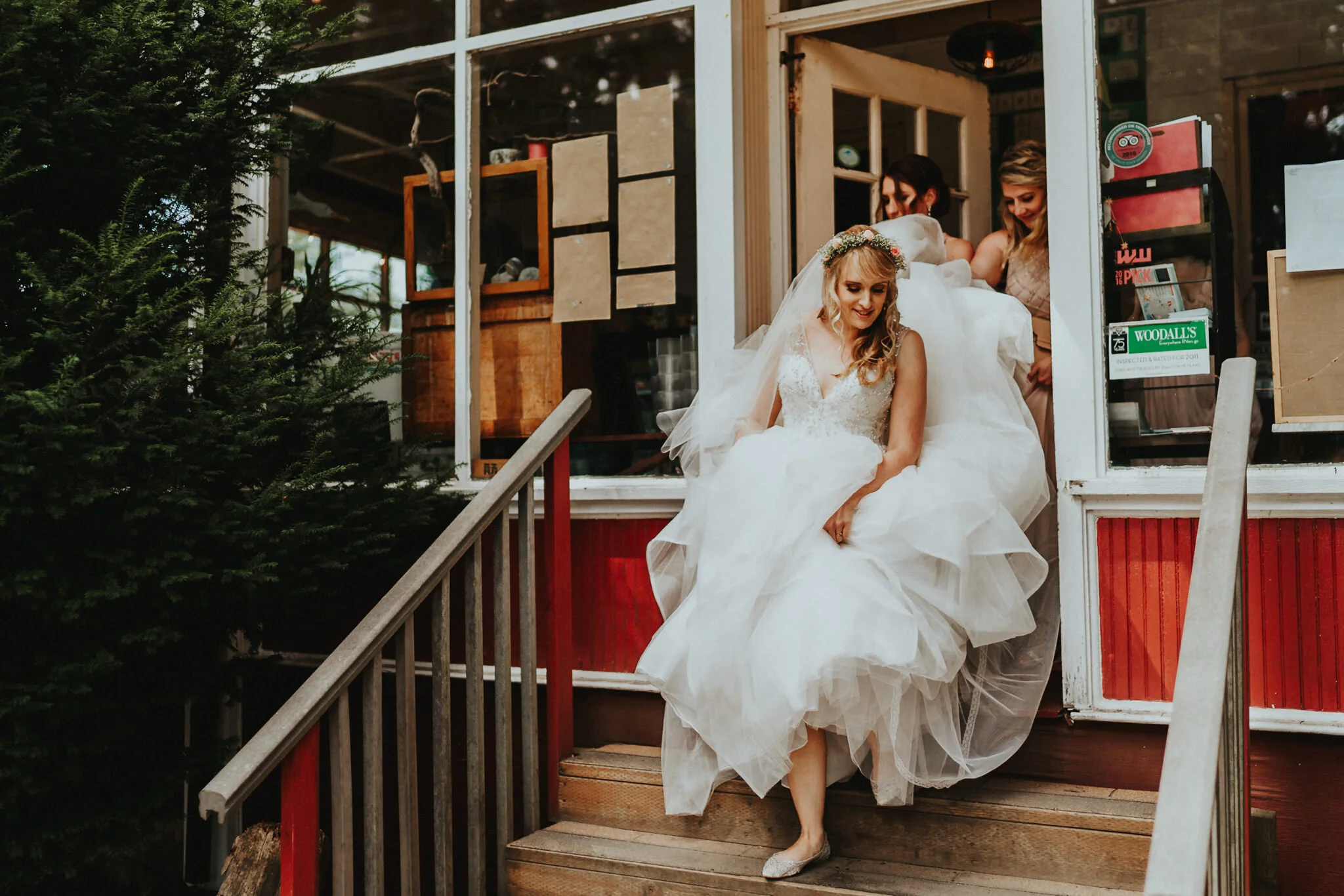 Bride fluff puff wedding dress out of building Sou'Wester