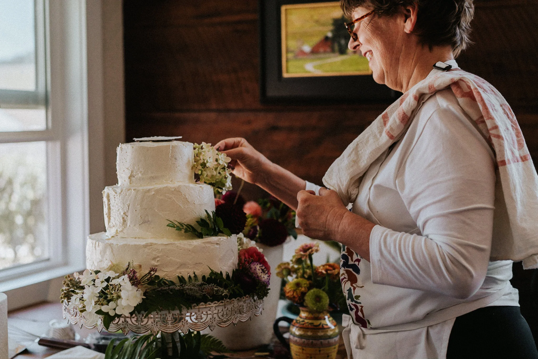 A wedding cake baker prepares the wedding cake