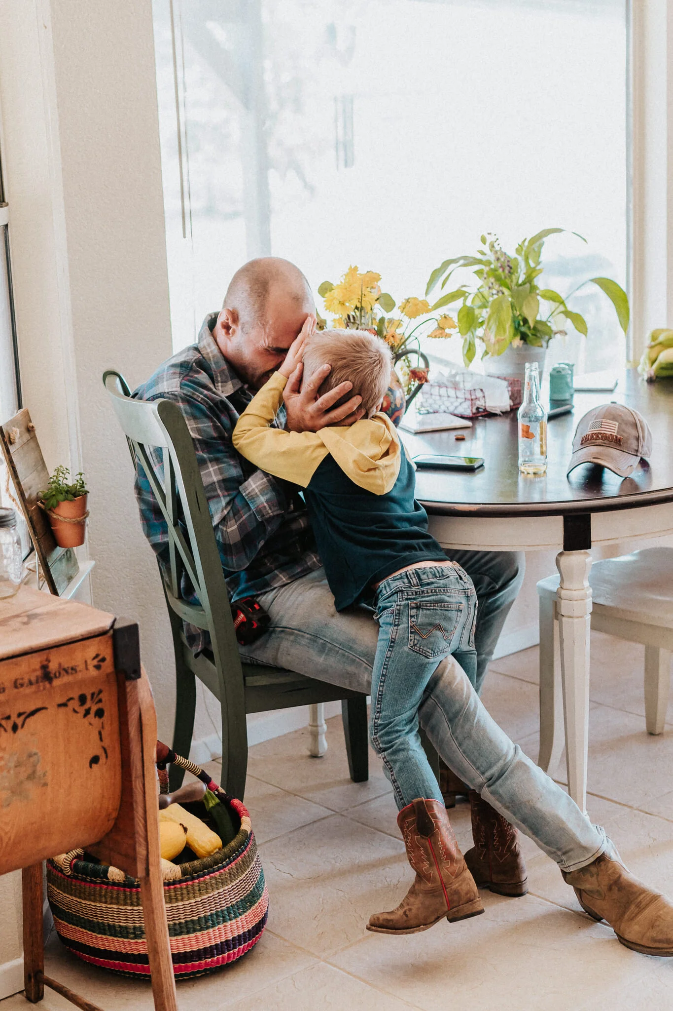 A man plays with his partner's son.