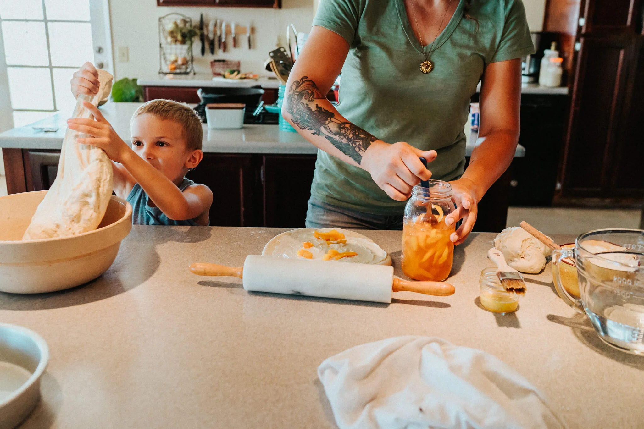 Son helps his mother with baking.