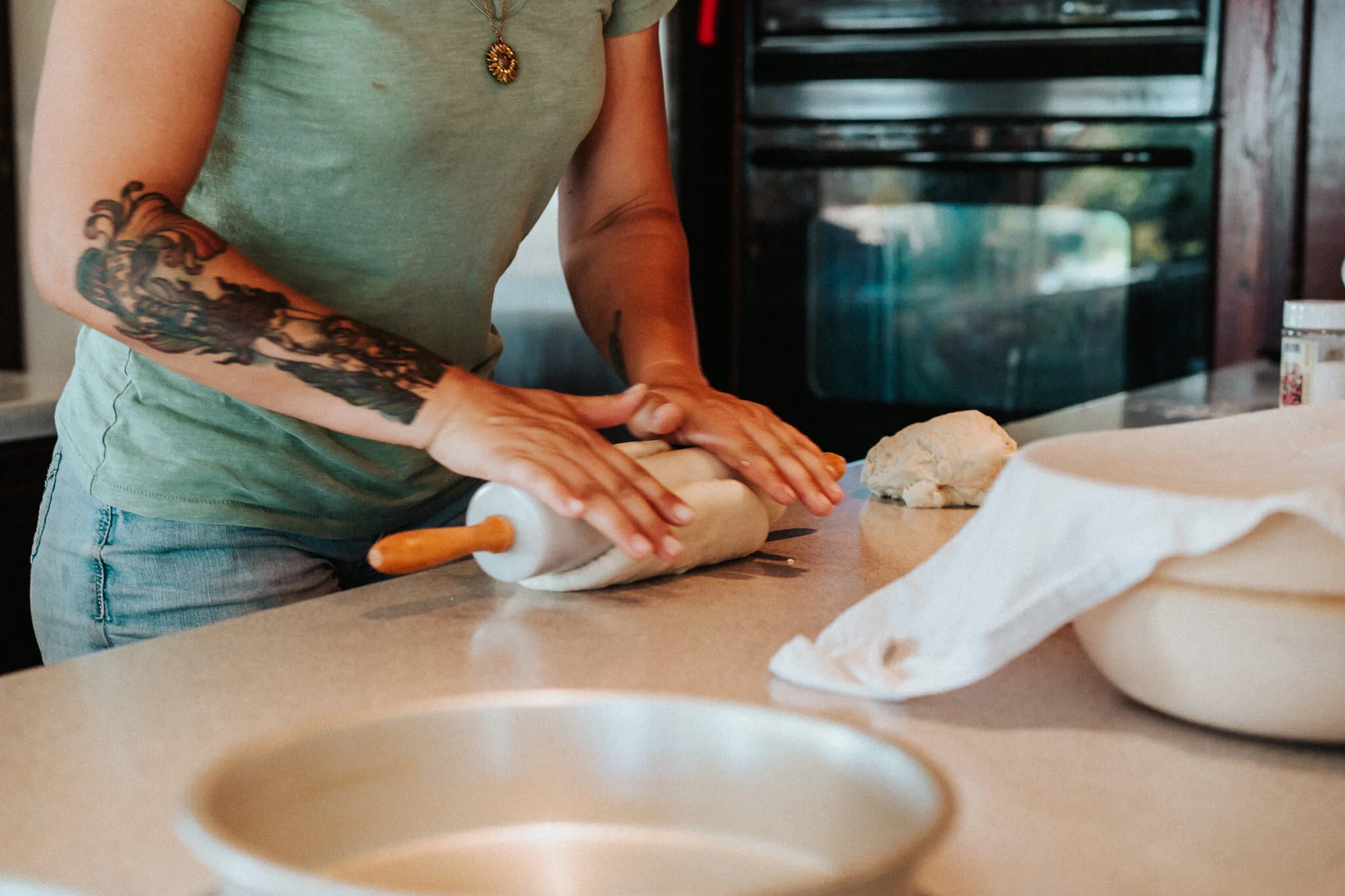 Kneading the dough with a rolling pin.
