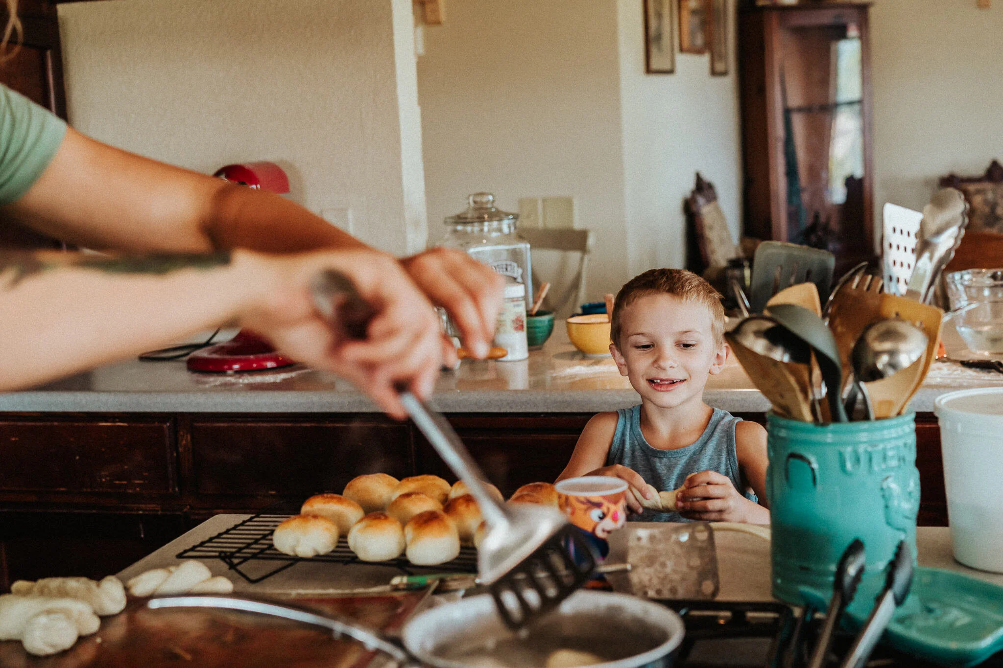A happy son in a homestead kitchen.