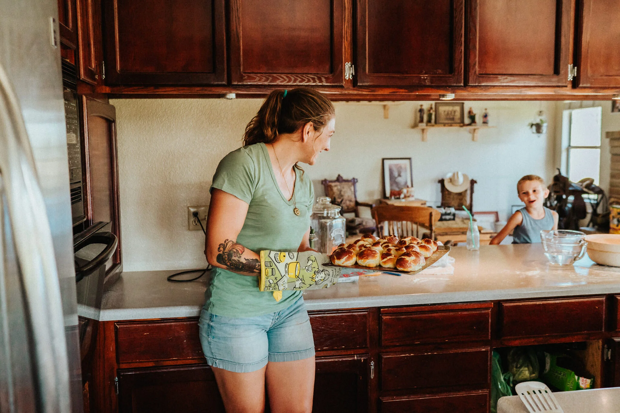 Pulling the pretzels out of the oven.