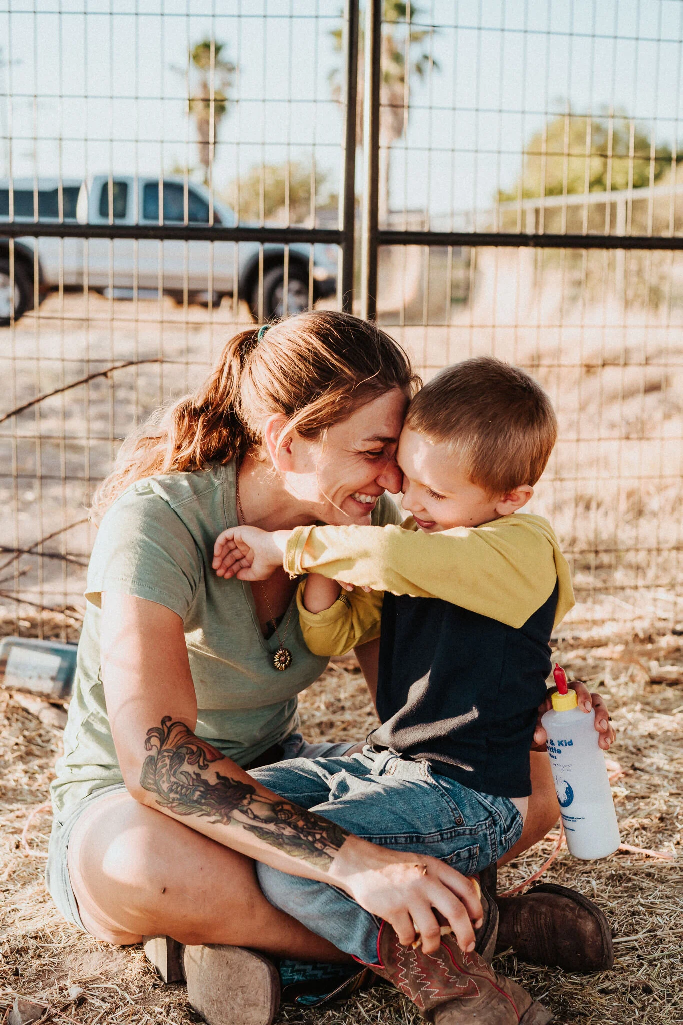 Mother and son hug.