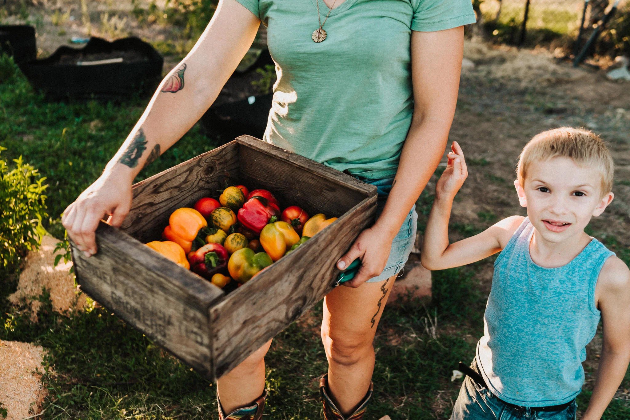 Boy and the garden bounty.
