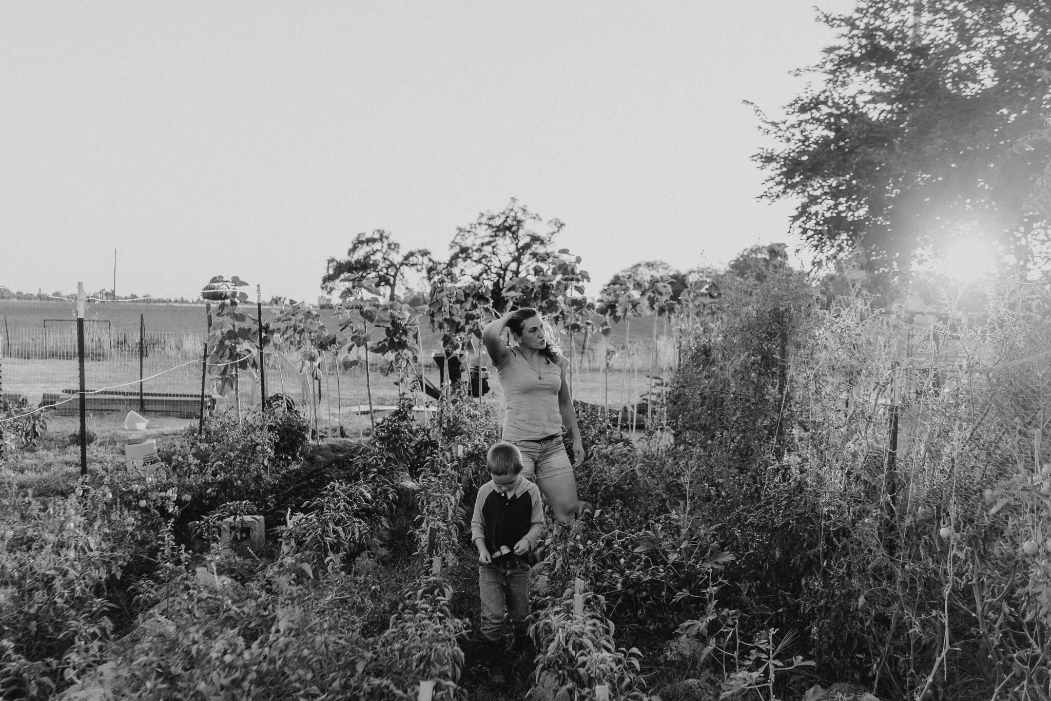 Surveying the garden with her son.