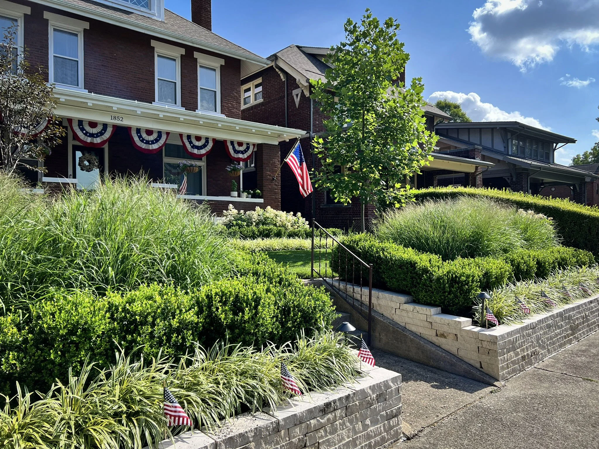 front yard landscape stone wall and plantings.jpg
