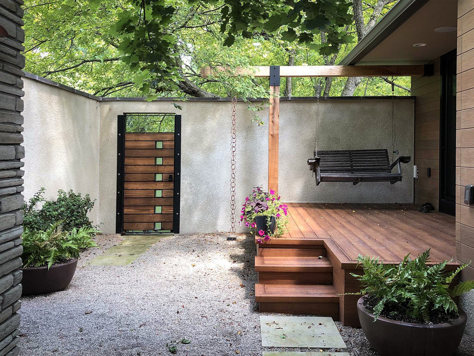courtyard landscape design columbus with gravel and deck.jpg