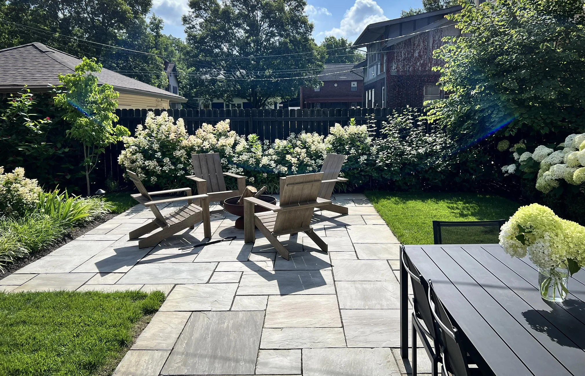 bluestone patio with firepit and dining table.jpg