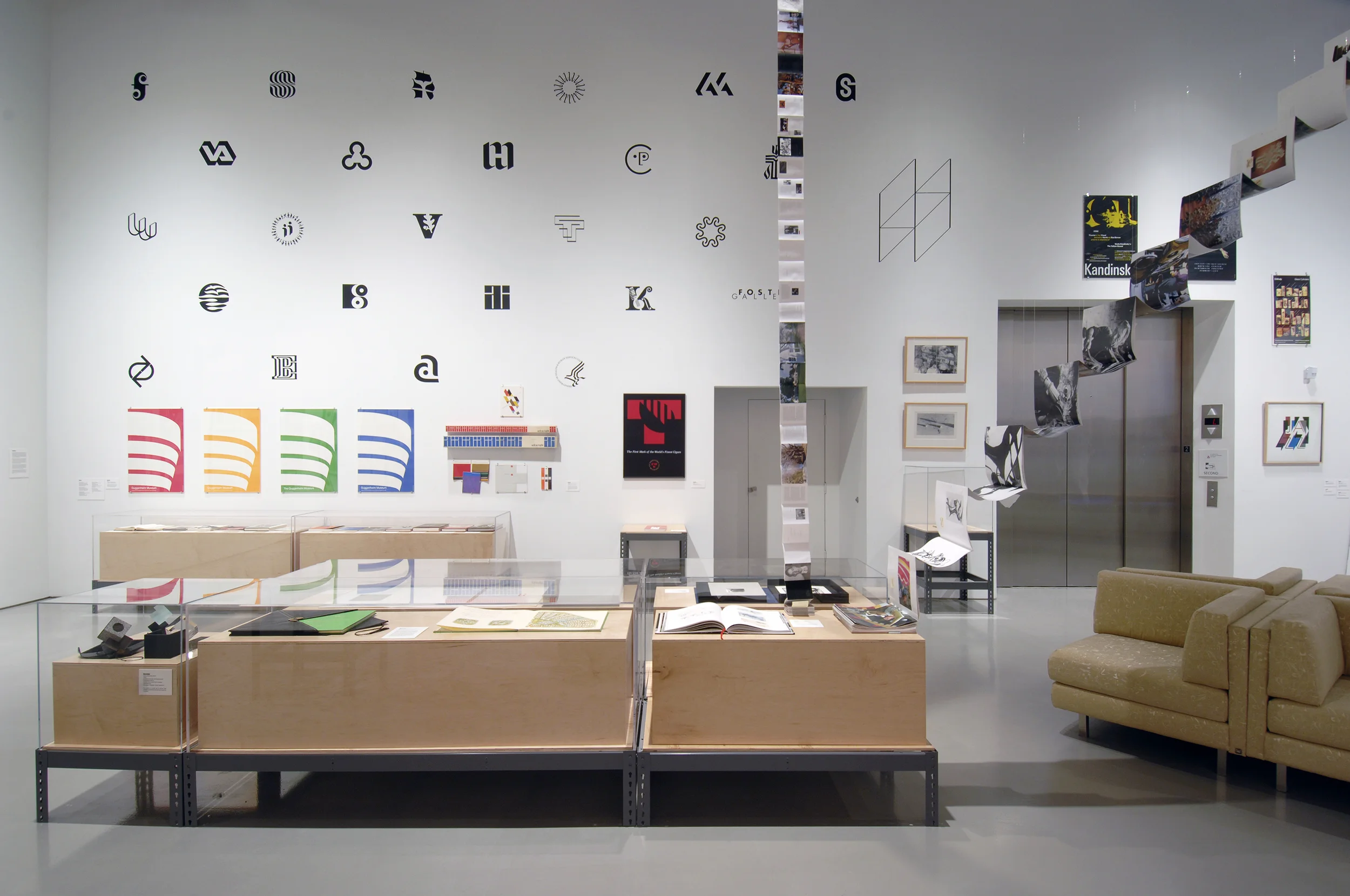 Visual Identity video and view of the installation from Graphic Content: Contemporary and Modern / Art and Design Charlie Harper, Malcolm Grear, Ryan McGinnis .