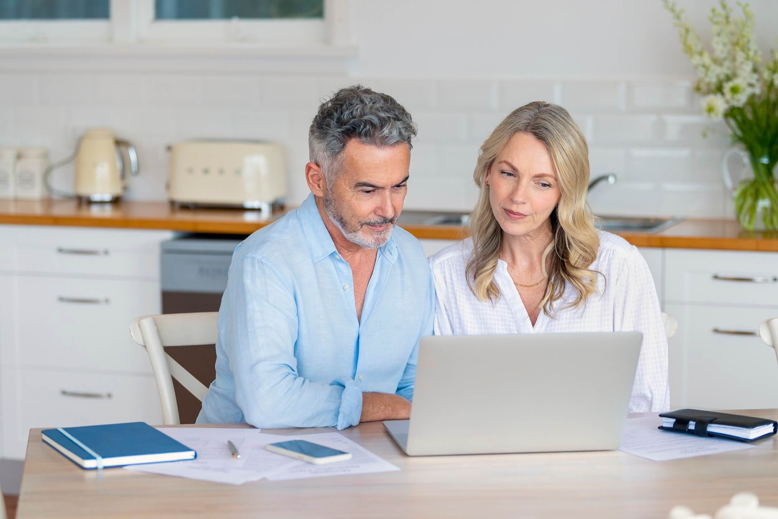 mature-couple-looking-at-laptop.jpg