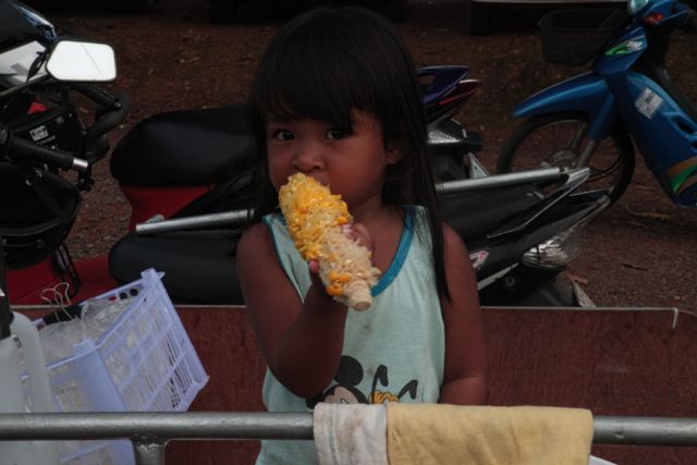 Kid eating Corn.jpg