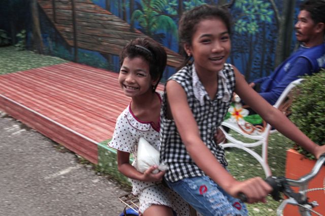 Kids Cruising on a Bike.jpg