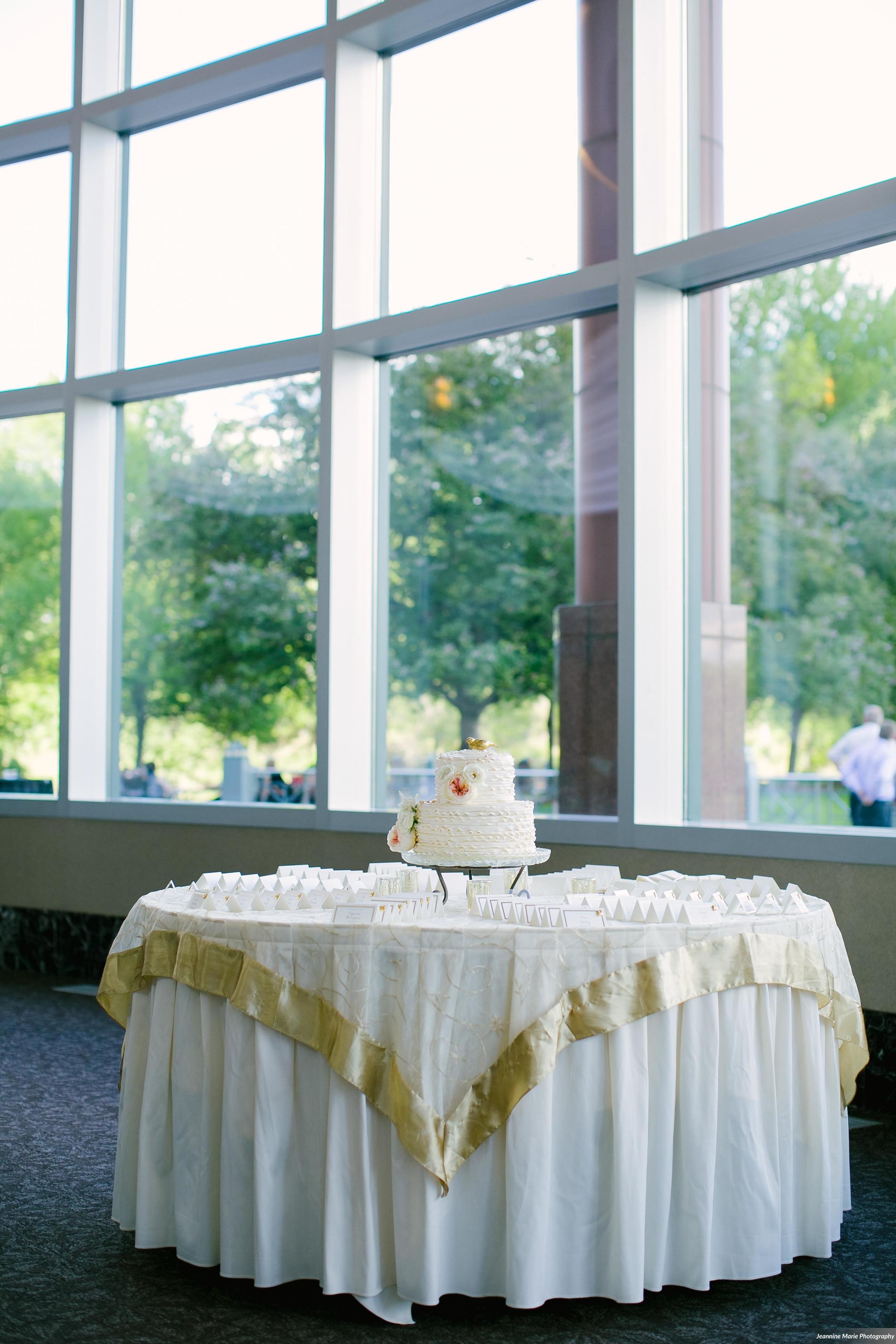 Photographer: Jeannine Marie Photography | Event Venue: The Carlson Towers Rotunda and Amphitheatre | Caterer: Bon Appetit at Carlson Center | Floral & Event Designer: W himsy Designs | Event Planner: Emily, The Simply Elegant Group | Cinema and Video: J Walter Anderson Photo and Video | Cake Designer: Queen of Cakes | Hair Stylist: Sanctuary Salonspa | Makeup Artist: Sanctuary Salonspa | Tuxedo and Mens Attire: Savvi Formalwear | Dress Designer: Stella York | Dress Store: Charlotte’s Bridal | Officiant: Grand Avenue Wedding Officiants | Other: International Cigars | Photo Booth Equipment: The Photo Booth Group | Invitation Designer: Wedding Paper Divas | DJ: Adagio Djay Entertainment