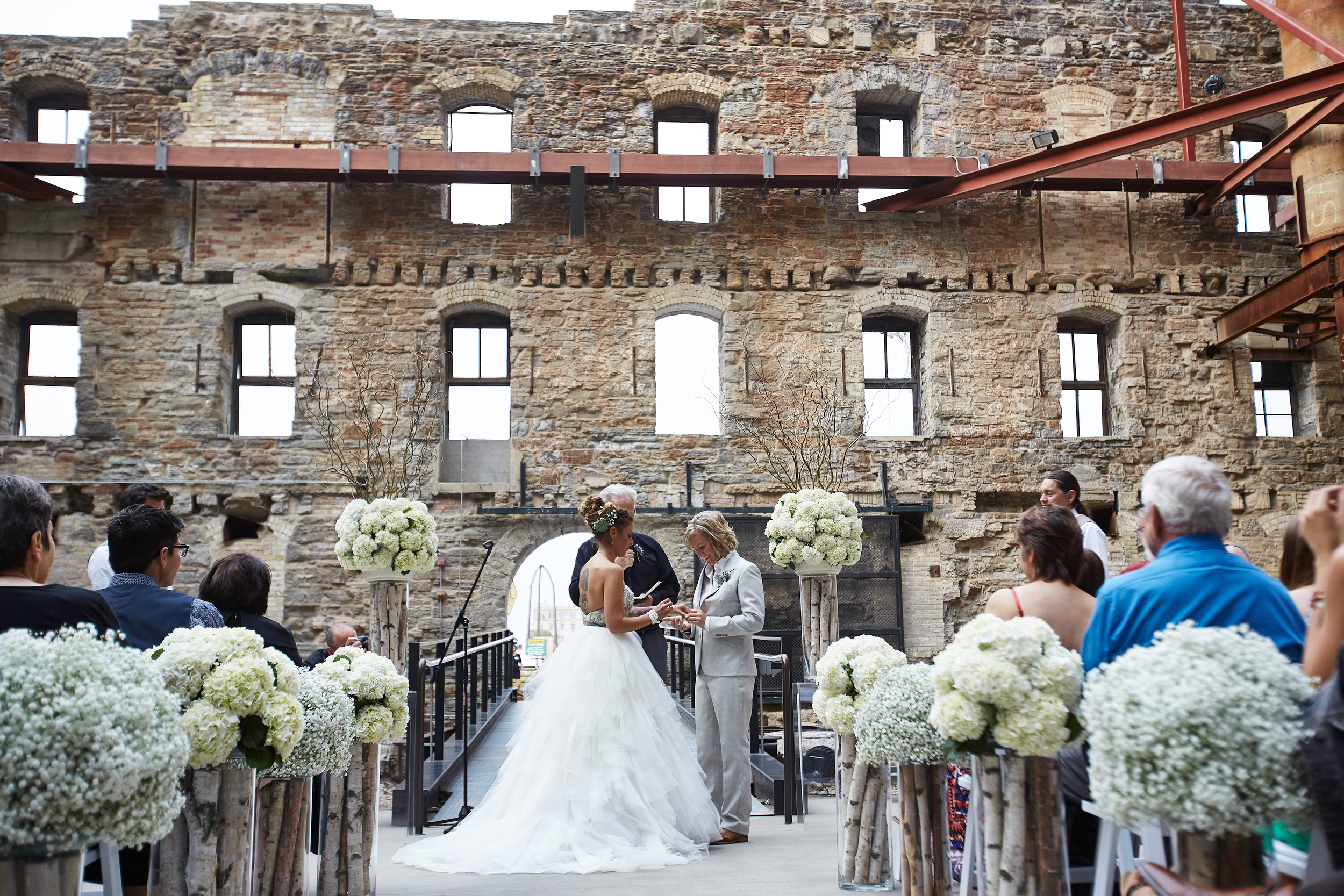 Photographer: Matt Blum Photography |Venue: Mill City Museum | Catering: D'Amico | Florist: Wisteria Design | Rentals + Decor: Linen Effects | Videographer: JWalter Anderson (part of Adiago Entertainment) | DJ: Adagio Entertainment |Photobooth: The Traveling Photobooth | Stationary: Minted | Hair + Make-Up: Naomy Carter (Lisa's hair was done at Hair Police ) 