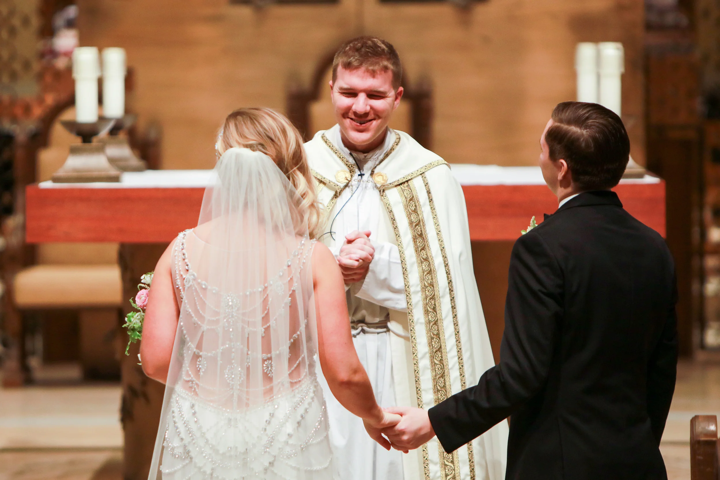 Planner: Nadia | Photographer: Justin Graddy | Dress: Bridal Accents Couture (Watters Gown) Ceremony: Chapel of Saint Thomas Aquinas (UST) | Reception: Aria | Caterer: Deco Catering | Florist: Studio Fleurette | Rentals + Decor: Linen Effects | Cake: Nadia Cakes | Calligrapher: Rosann K | Officiant: Fr. James Stiles / St. Odilia Catholic Church | DJ: Instant Request / Anthony DuBose | Hair + Makeup: Julie Swenson / Primped | Transportation: Total Limo
