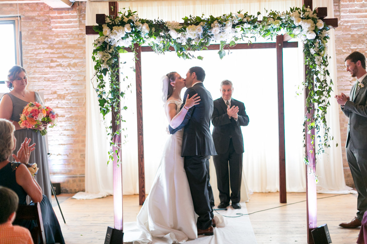 Vendors: Planner: Ashley C. – Simply Elegant Group | Photography: Wakefield Photo | Hair/Makeup: Bev Esquivel – with Kate Johnson Artistry | Venue: Lacuna Artist Lofts | Florist: Victoria Claus – AEG Productions | Caterer: LM Catering | Cake: Sweet Mandy B’s | Ceremony Music: Alex Sokol / Common Knowledge| DJ: Style Matters | Lighting: SC Lighting Design | Photobooth: Traveling Photo Booth | Transportation: Second City Trolley