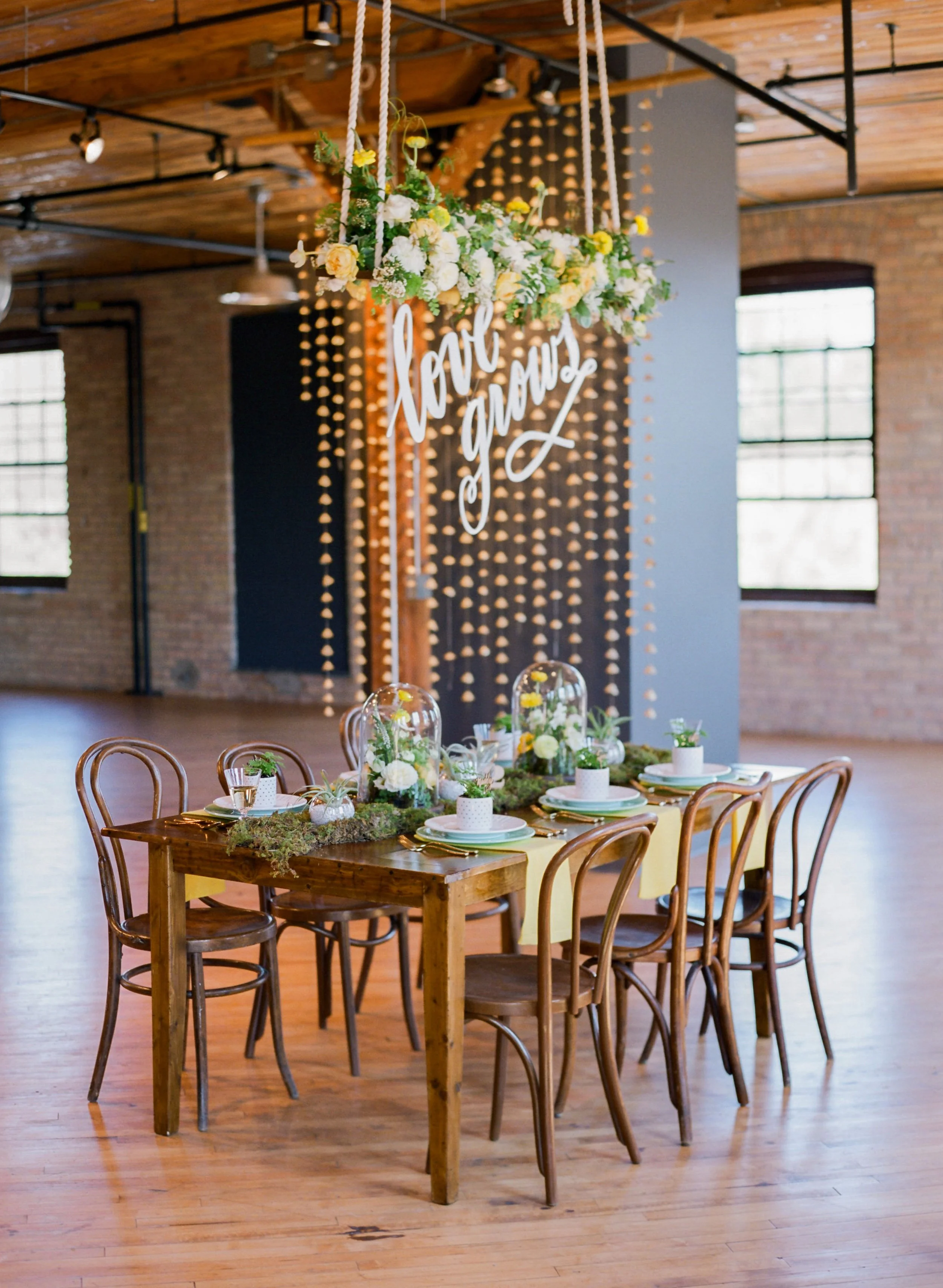 Vendors: Photography: Jody Savage Photography | Videography: Acowsay | Groomswear: Savvy Formalwear | Dress: Natalie by Truvelle , A and B Bridal Shop | Makeup: Julie Swenson Beauty | Hair: Teanna Moye Artistry | Venue: Solar Arts Chowgirls | Rentals & Design: On Solid Ground Vintage Rentals | Floral Design: Studio Fleurette | Florals: Fifty Flowers | Cake Topper, Custom Lettering, Escort+Place Cards: Splendid Supply Co. | Cake Stands, Guest Book + Invites: Minted | Food + Cake: Chow Girl Catering