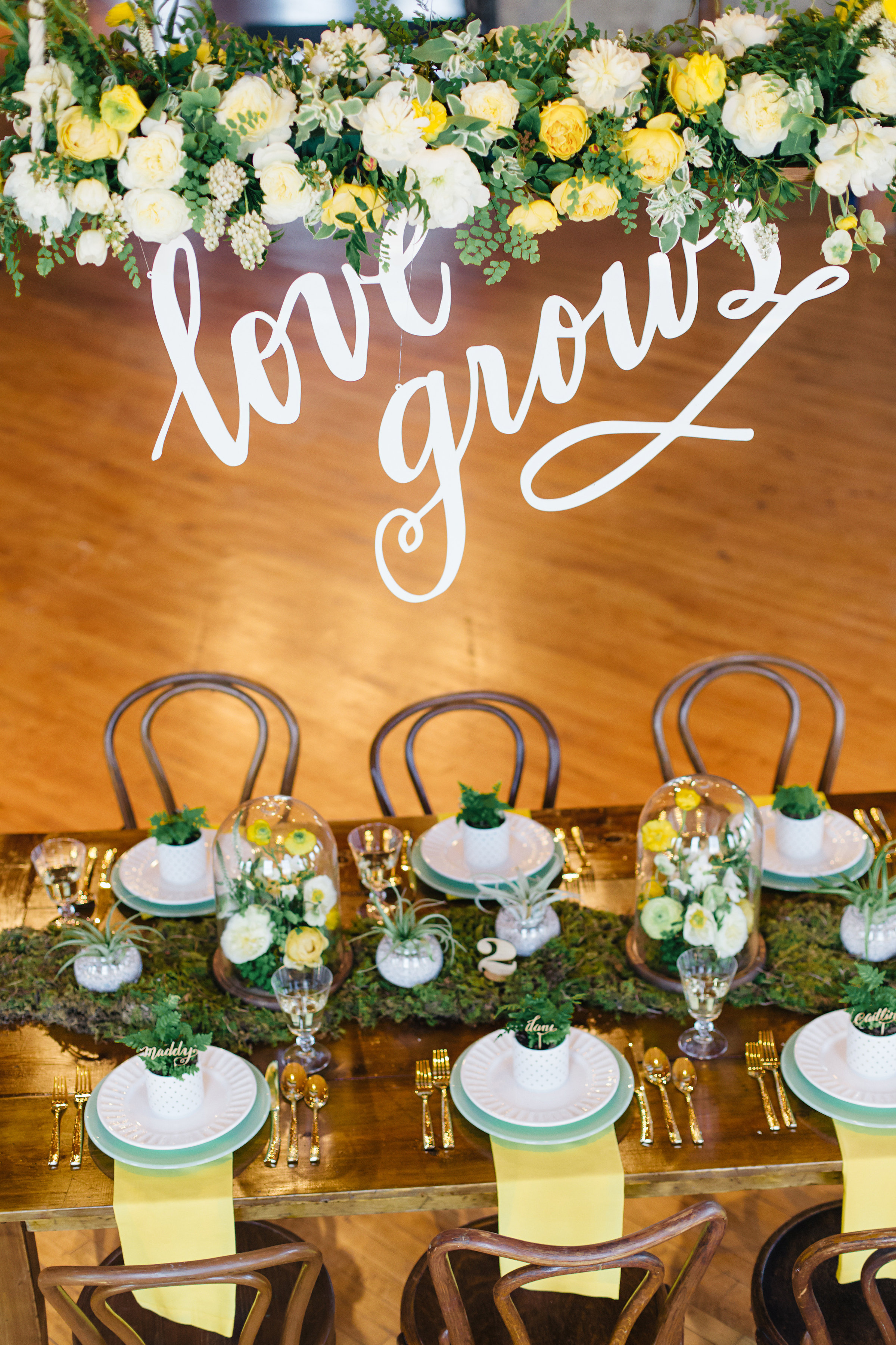 Vendors: Photography: Jody Savage Photography | Videography: Acowsay | Groomswear: Savvy Formalwear | Dress: Natalie by Truvelle , A and B Bridal Shop | Makeup: Julie Swenson Beauty | Hair: Teanna Moye Artistry | Venue: Solar Arts Chowgirls | Rentals & Design: On Solid Ground Vintage Rentals | Floral Design: Studio Fleurette | Florals: Fifty Flowers | Cake Topper, Custom Lettering, Escort+Place Cards: Splendid Supply Co. | Cake Stands, Guest Book + Invites: Minted | Food + Cake: Chow Girl Catering