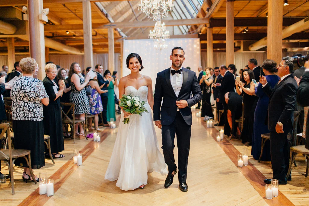 Photography: Tim Tab Studios | Coordination: The Simply Elegant Group, Lindsay | Floral design: The Bread and Butterfly | Decor: Art of Imagination | Hair: Holli Beauty | Makeup: Joanna B Artistry and Anjelica Bannos | Bride’s gown: Sarah Seven | Groom's tux: The Black Tux | Bridesmaids: Show Me Your MuMu | Venue: Bridgeport Art Center | Catering: Limelight Catering