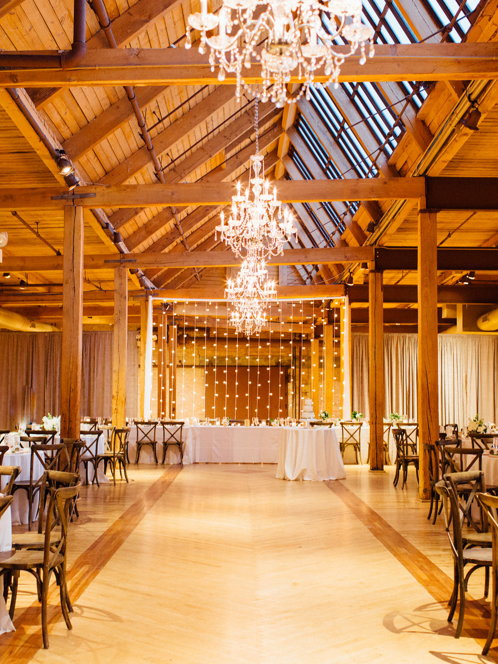 Photography: Tim Tab Studios | Coordination: The Simply Elegant Group, Lindsay | Floral design: The Bread and Butterfly | Decor: Art of Imagination | Hair: Holli Beauty | Makeup: Joanna B Artistry and Anjelica Bannos | Bride’s gown: Sarah Seven | Groom's tux: The Black Tux | Bridesmaids: Show Me Your MuMu | Venue: Bridgeport Art Center | Catering: Limelight Catering