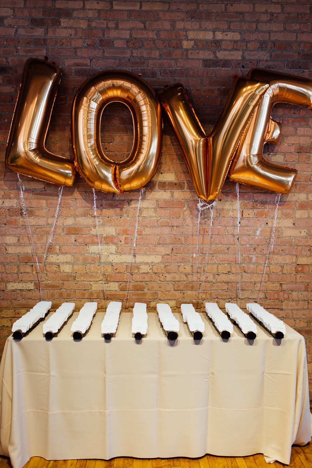 Photography: Tim Tab Studios | Coordination: The Simply Elegant Group, Lindsay | Floral design: The Bread and Butterfly | Decor: Art of Imagination | Hair: Holli Beauty | Makeup: Joanna B Artistry and Anjelica Bannos | Bride’s gown: Sarah Seven | Groom's tux: The Black Tux | Bridesmaids: Show Me Your MuMu | Venue: Bridgeport Art Center | Catering: Limelight Catering