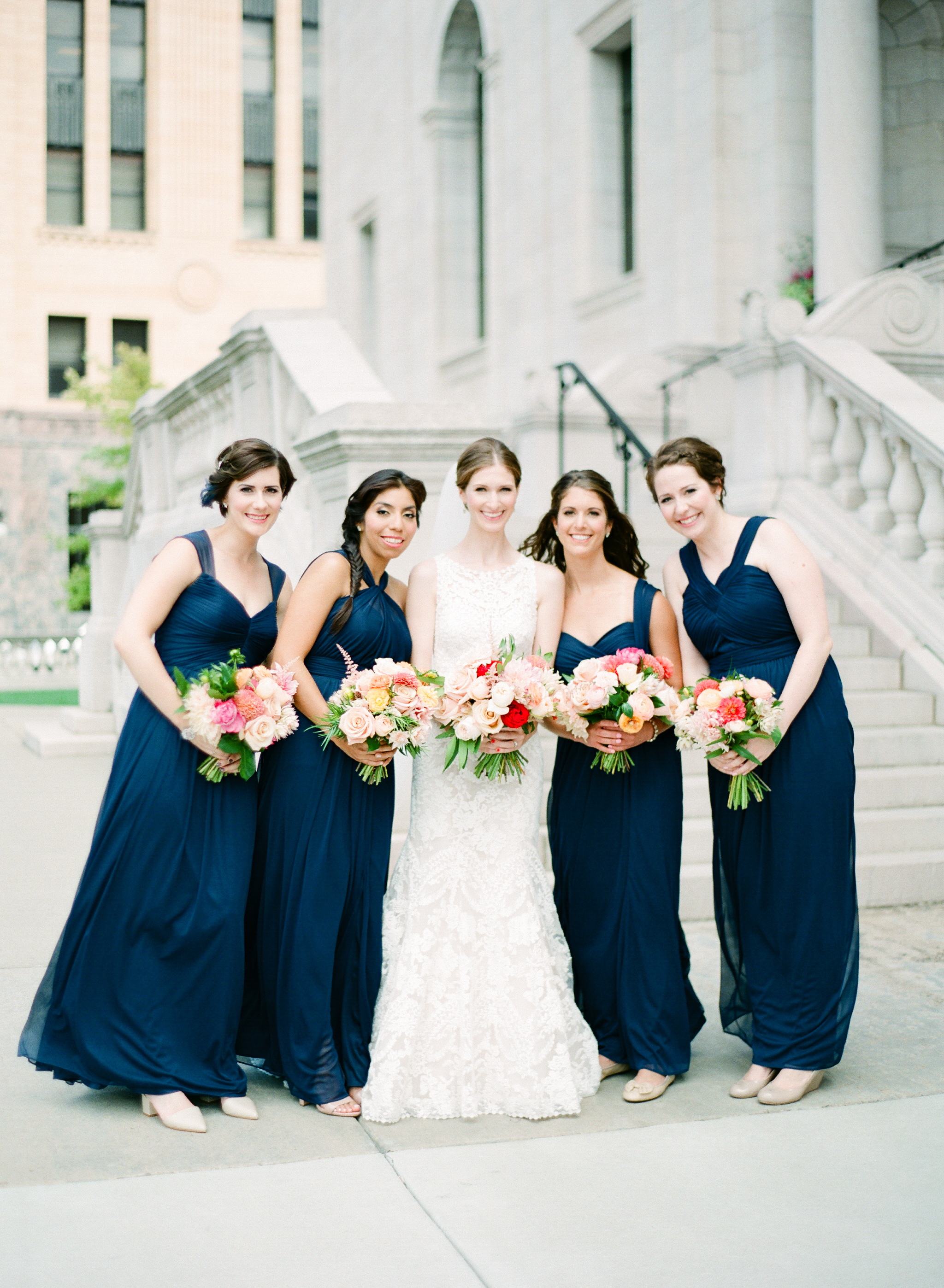 Vendors: Photographer: Laura Ivanova | Invitations: Minted | Ceremony Venue: Hennepin Avenue United Methodist Church | Reception Venue: James J. Hill Center | Flowers: Molly’s Flower Studio | Hair/MakeUp Artist: Warpaint Beauty Agency | Bride's Dress: BHLDN | Men's Attire: Hugo Boss | Linens/Decor/Rentals: Apres Party and Tent | Entertainment: Adagio Entertainment | Catering: Green Mangos Catering | Bar: Mintahoe | Cake: Sweet Retreat MN | Transportation: Northfield Lines , Eclipse Limos & Valley Limos