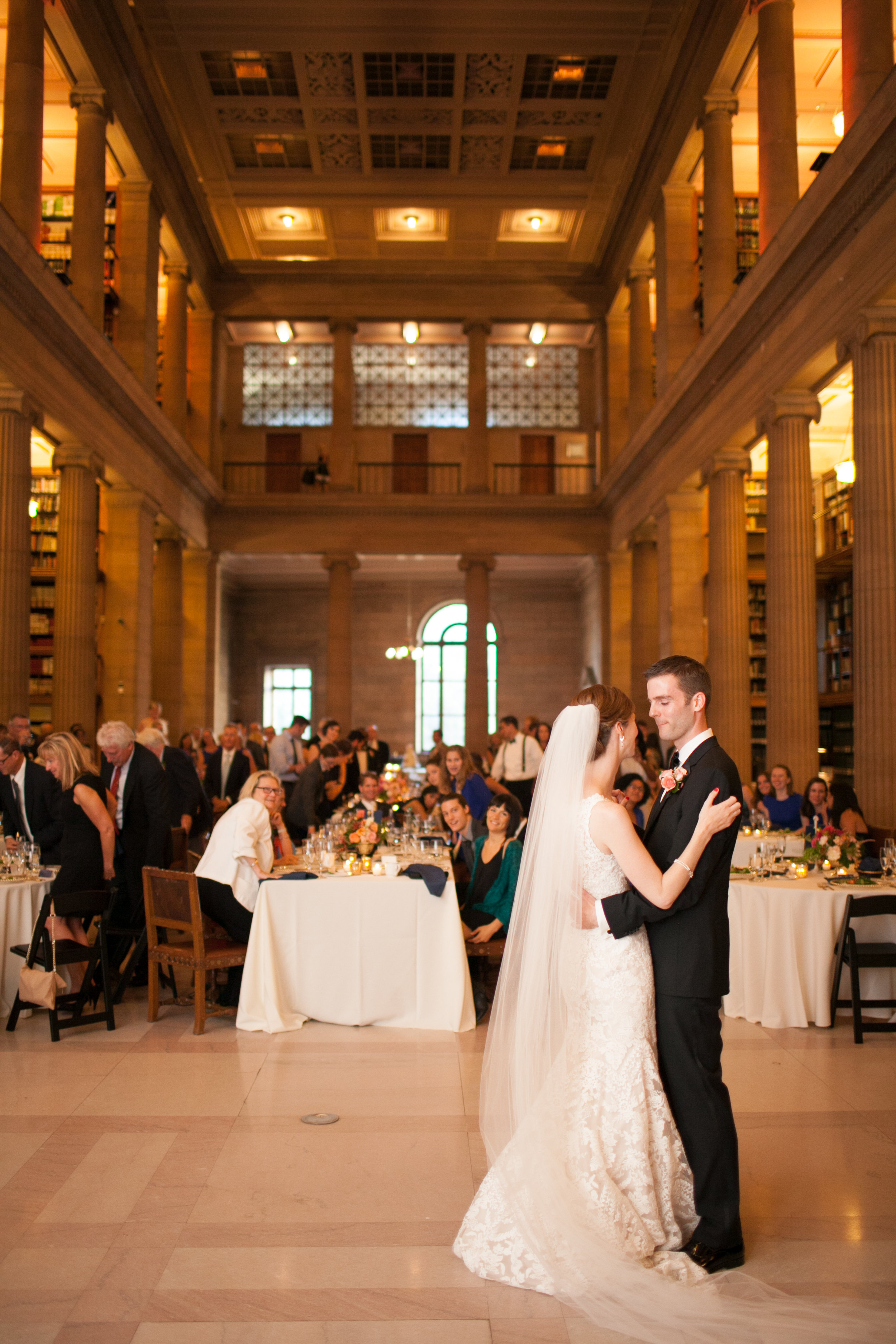 Vendors: Photographer: Laura Ivanova | Invitations: Minted | Ceremony Venue: Hennepin Avenue United Methodist Church | Reception Venue: James J. Hill Center | Flowers: Molly’s Flower Studio | Hair/MakeUp Artist: Warpaint Beauty Agency | Bride's Dress: BHLDN | Men's Attire: Hugo Boss | Linens/Decor/Rentals: Apres Party and Tent | Entertainment: Adagio Entertainment | Catering: Green Mangos Catering | Bar: Mintahoe | Cake: Sweet Retreat MN | Transportation: Northfield Lines , Eclipse Limos & Valley Limos