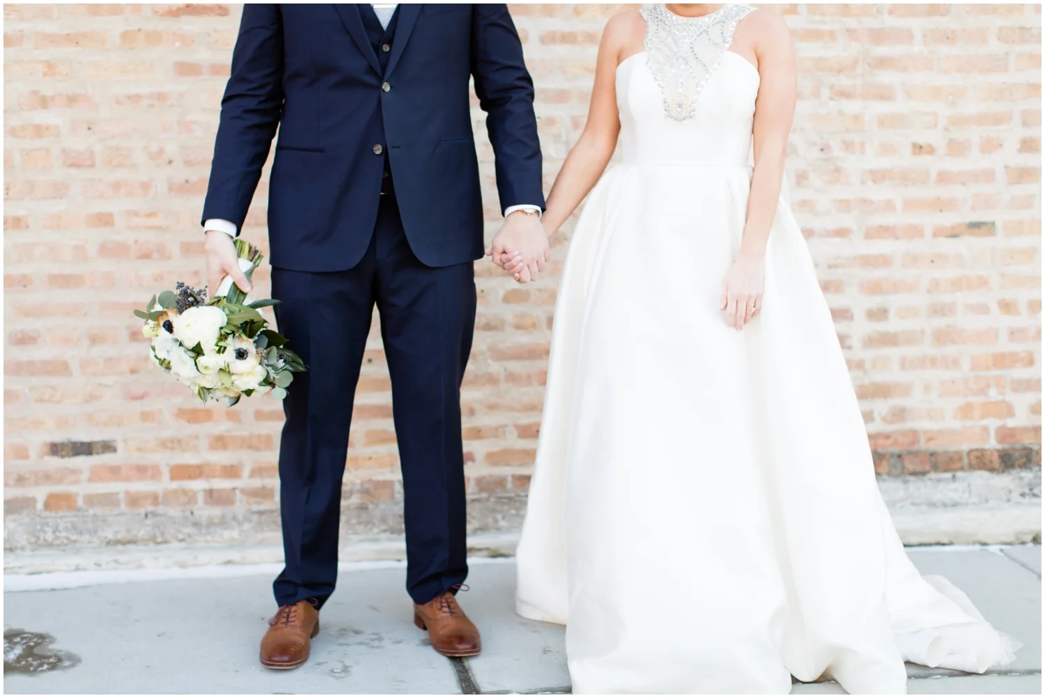 groom holding the bridal bouquet