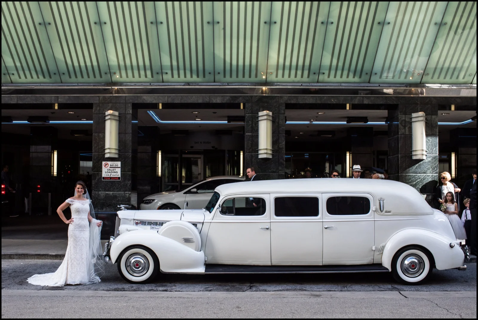 bride by the vintage car