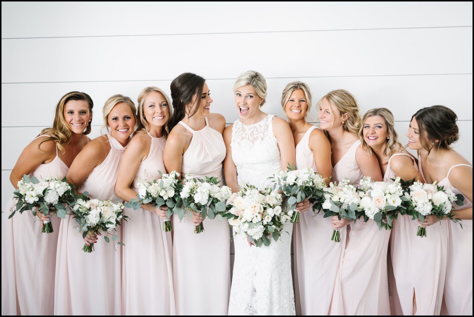 bridesmaids holding wedding bouquets
