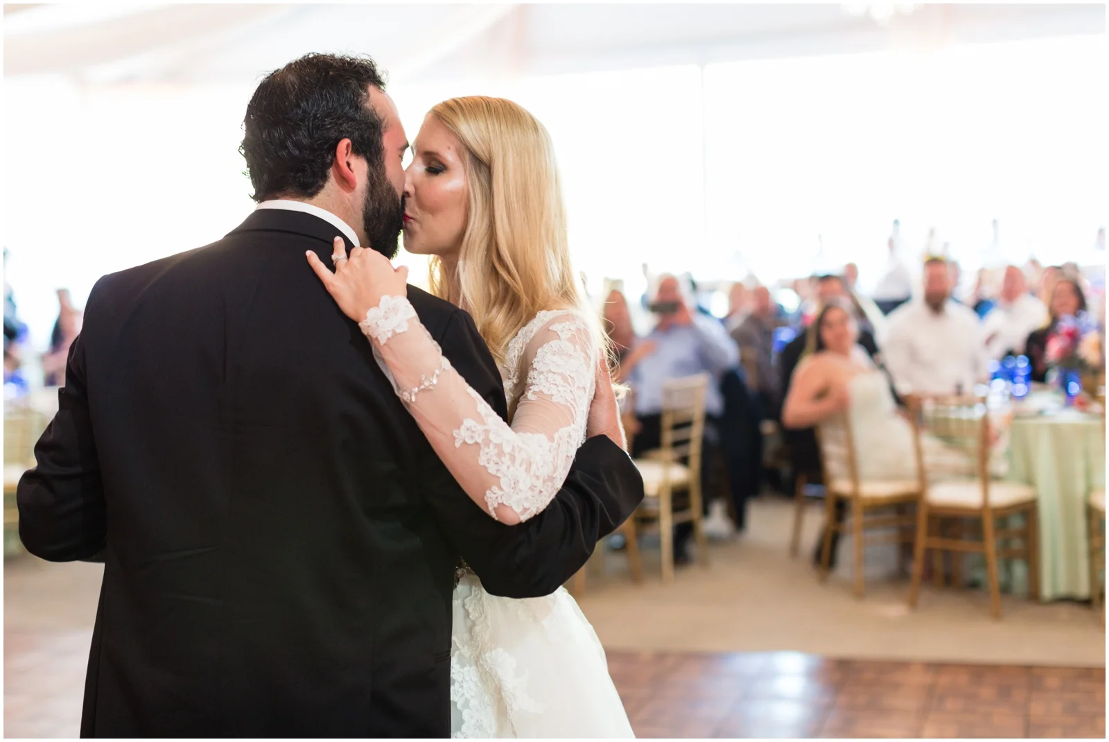 bride and groom kiss at the wedding