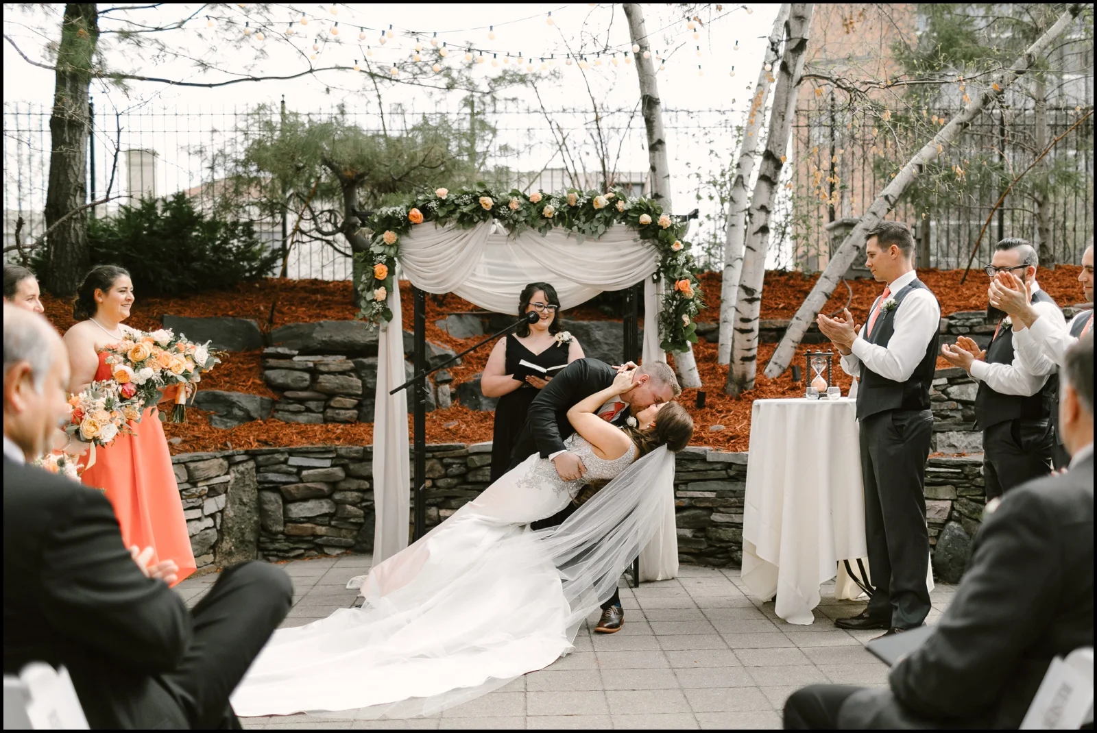 Bride and groom kiss at their wedding ceremony