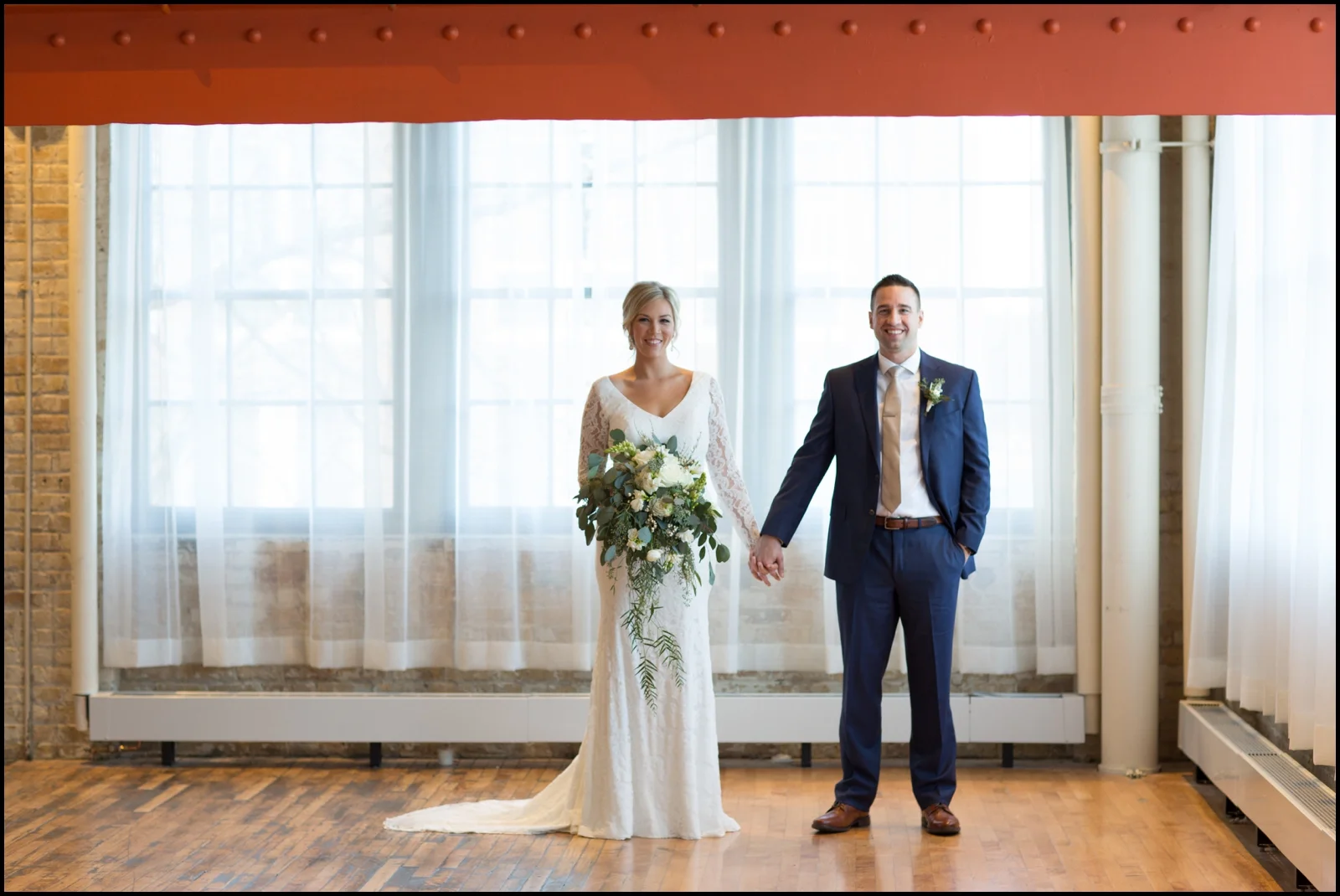 Bride and groom holding hands