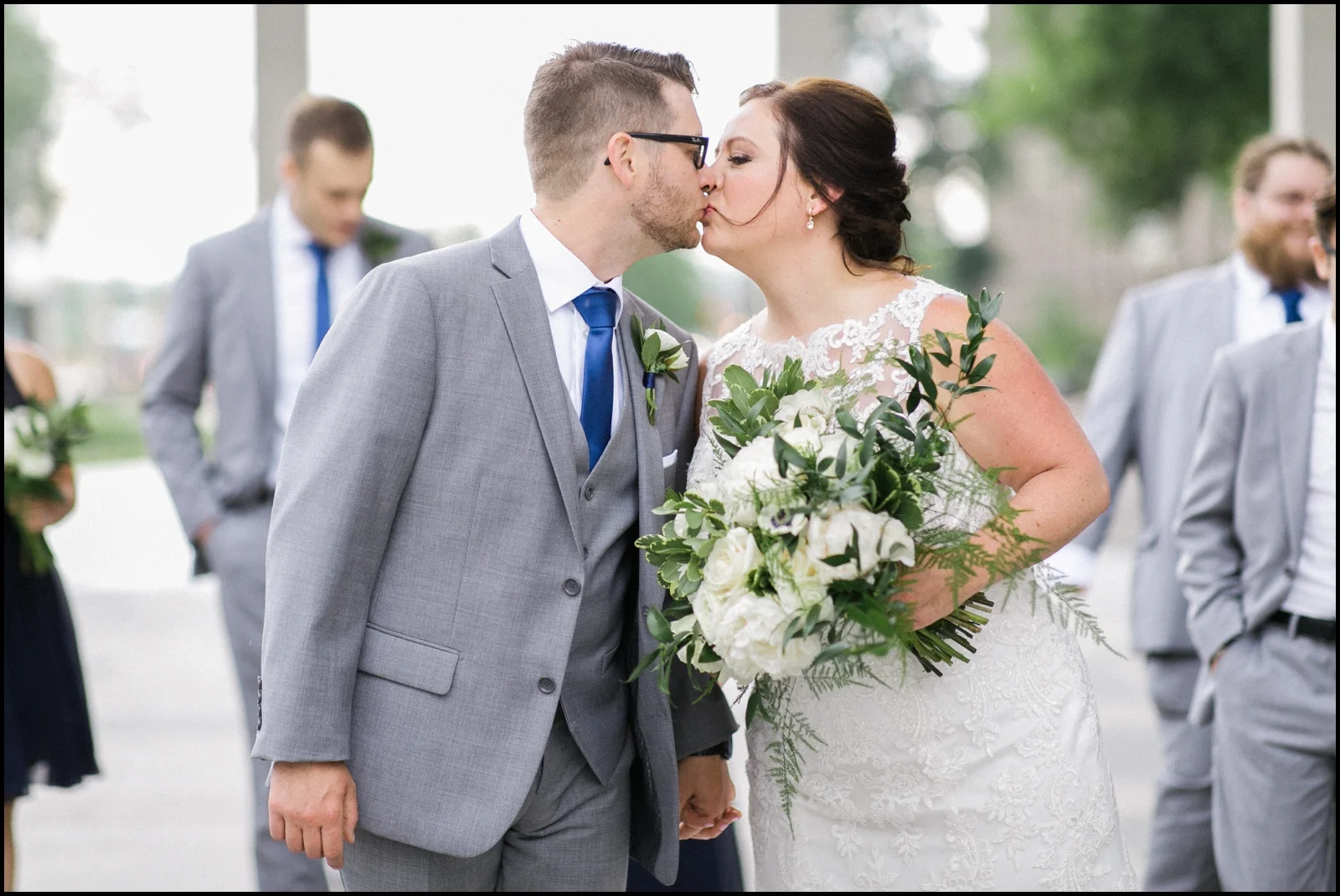 Bride and groom kiss