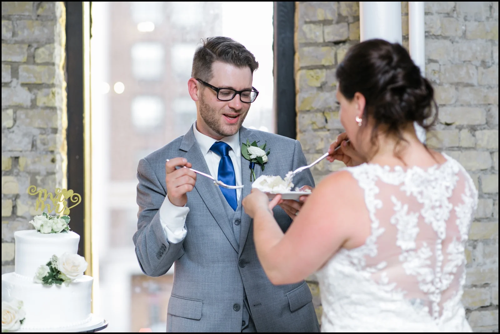 Bride and groom cut the cake