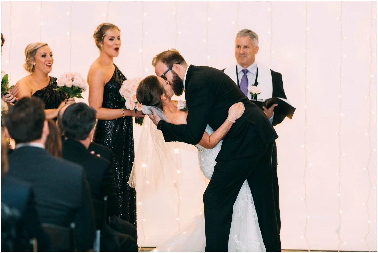 bride and groom kiss at their wedding ceremony