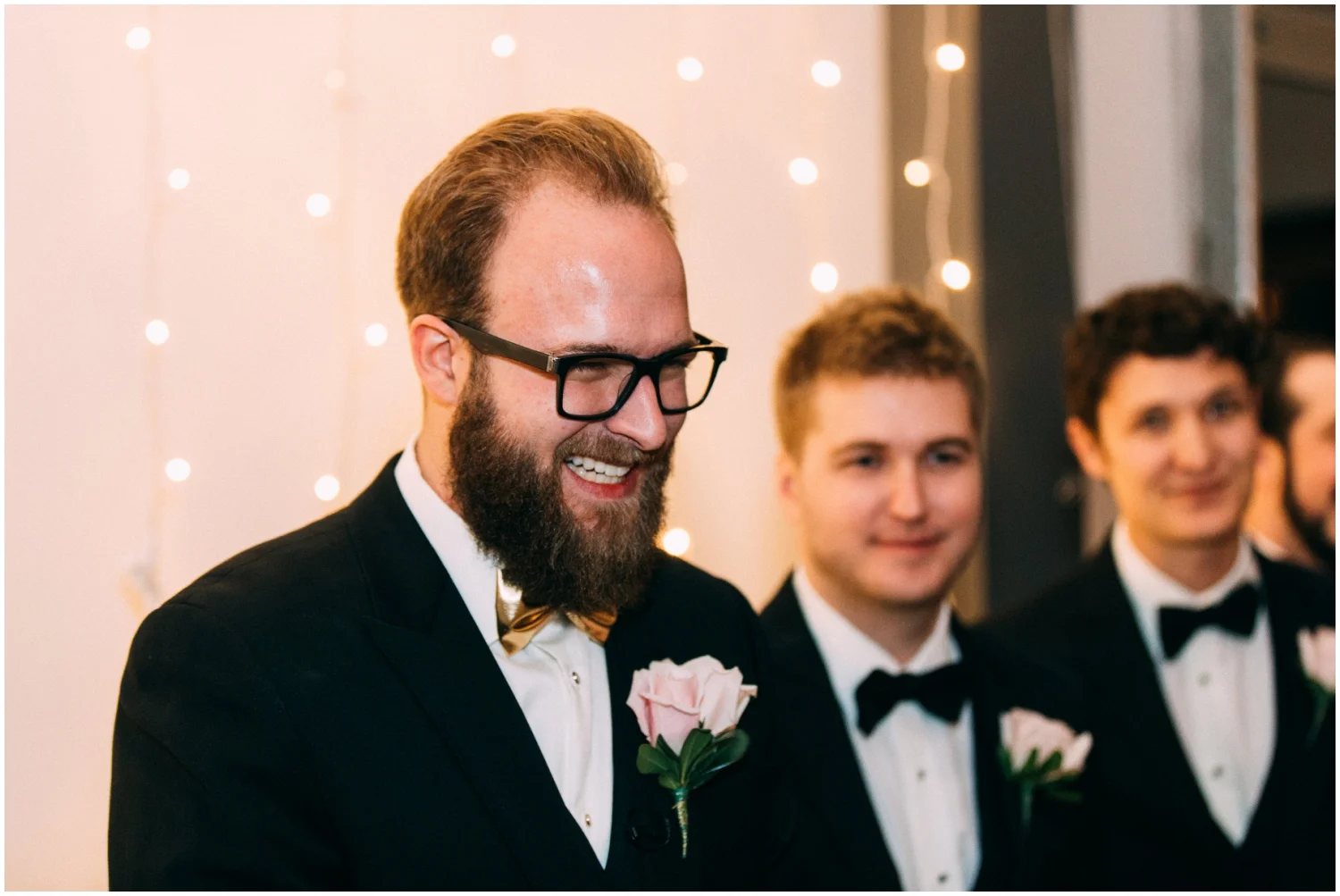 Groom watching the bride walk down the aisle