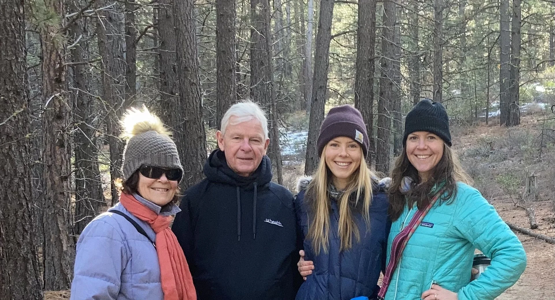 Dr. Alison Hearst spending time with family outdoors in the woods.