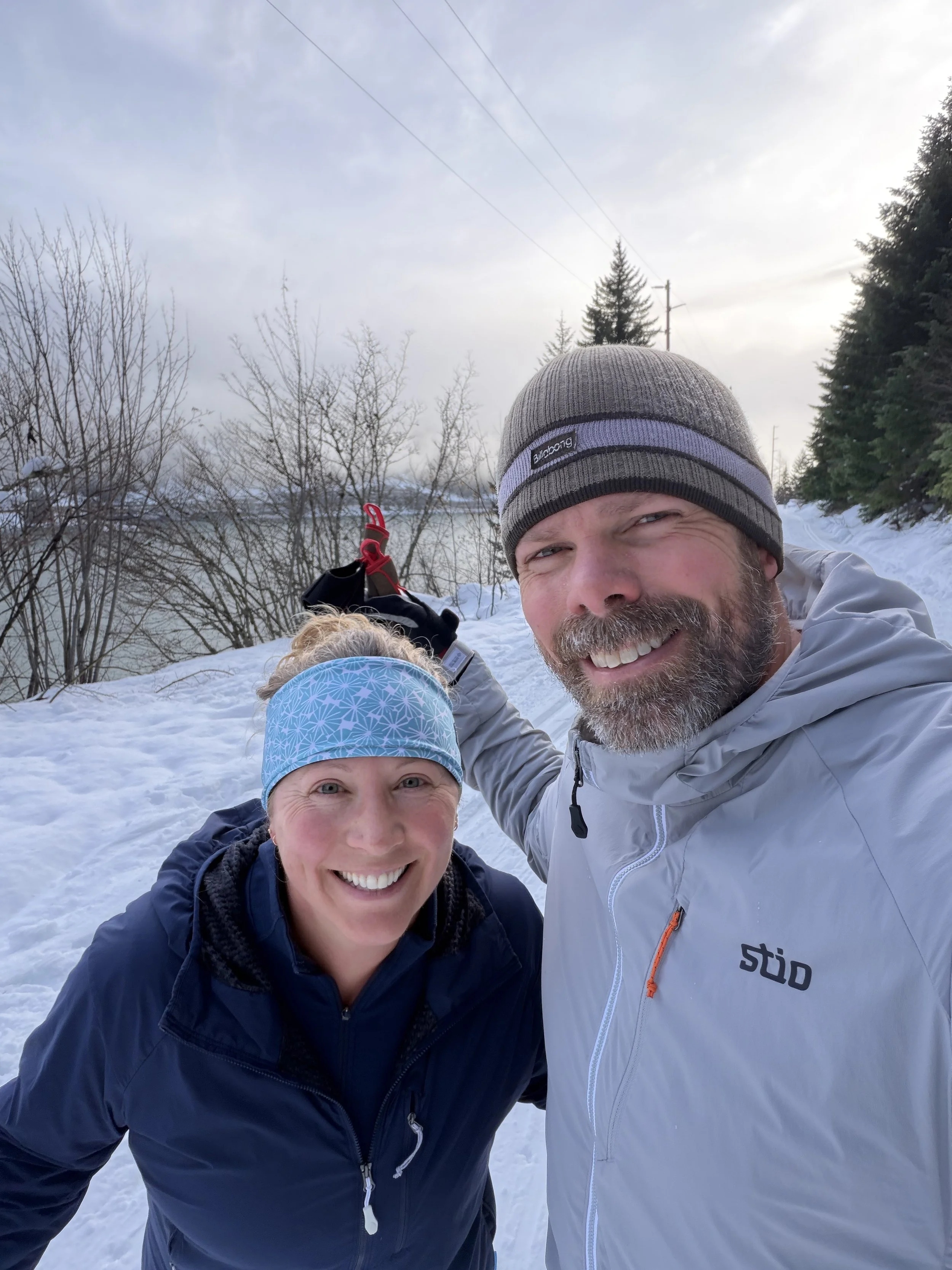Dr. Lea McKinstry and her husband enjoying a snowy day outdoors.