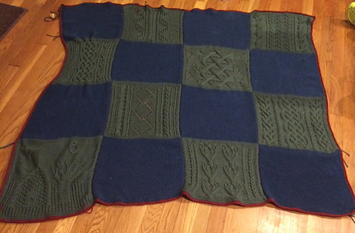 The afghan as of September 21, 2015. All of the pieces are knit, seamed together and edged in crochet.